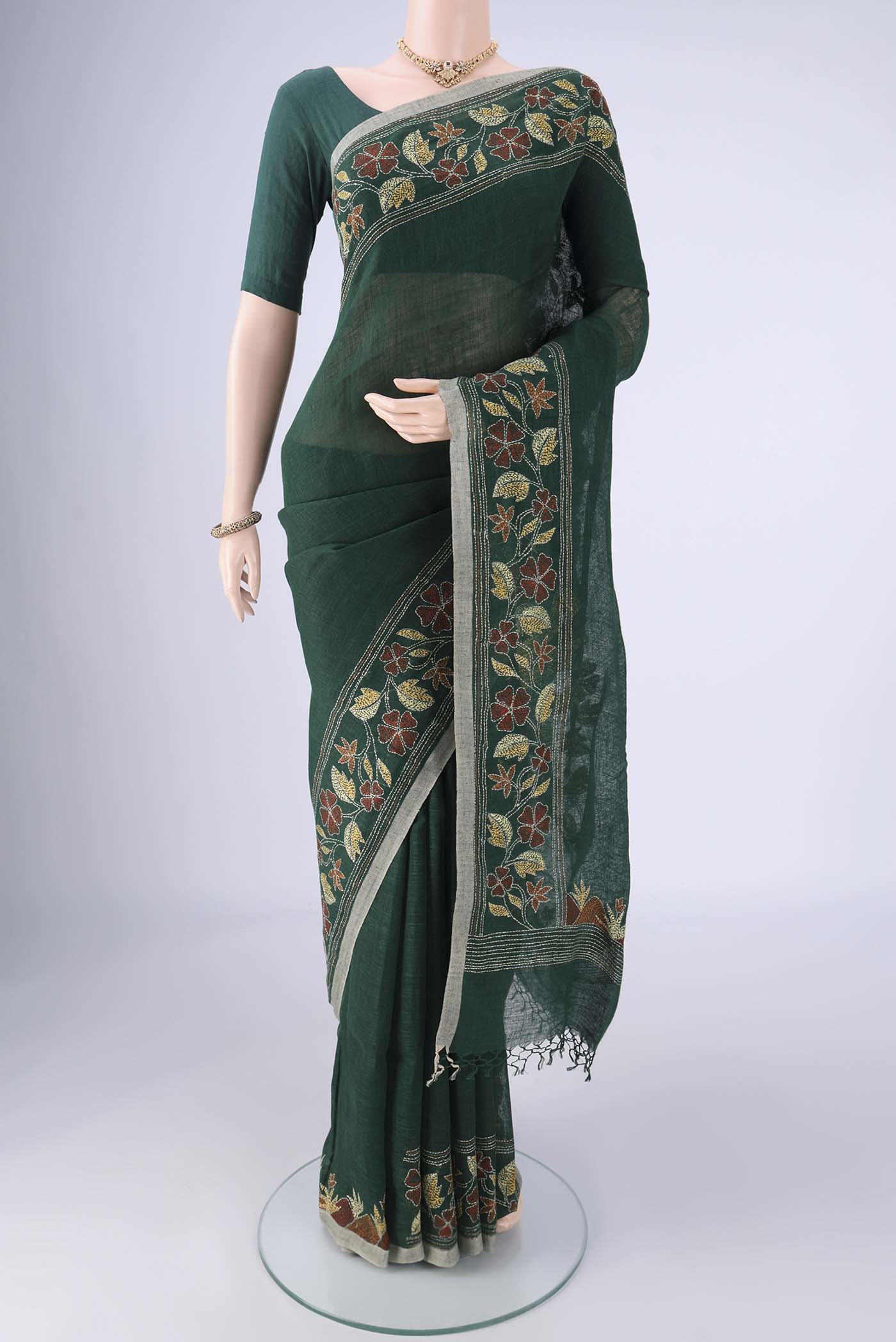 Bottle Green Linen Cotton Saree with Kantha Work on the body and Thread Border.  displayed on a mannequin