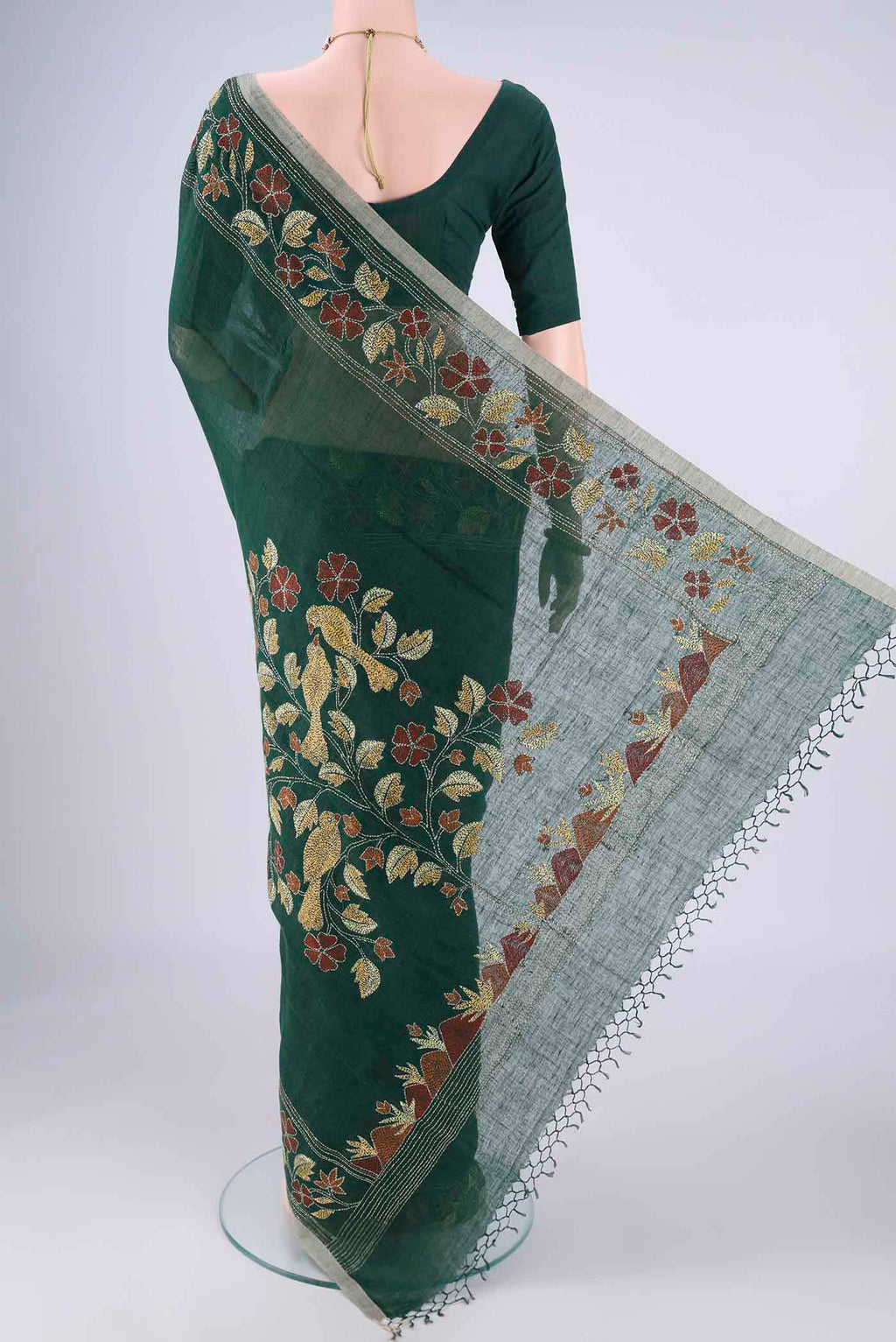 Flat view of Bottle Green Linen Cotton Saree with Kantha Work on the body and Thread Border. 