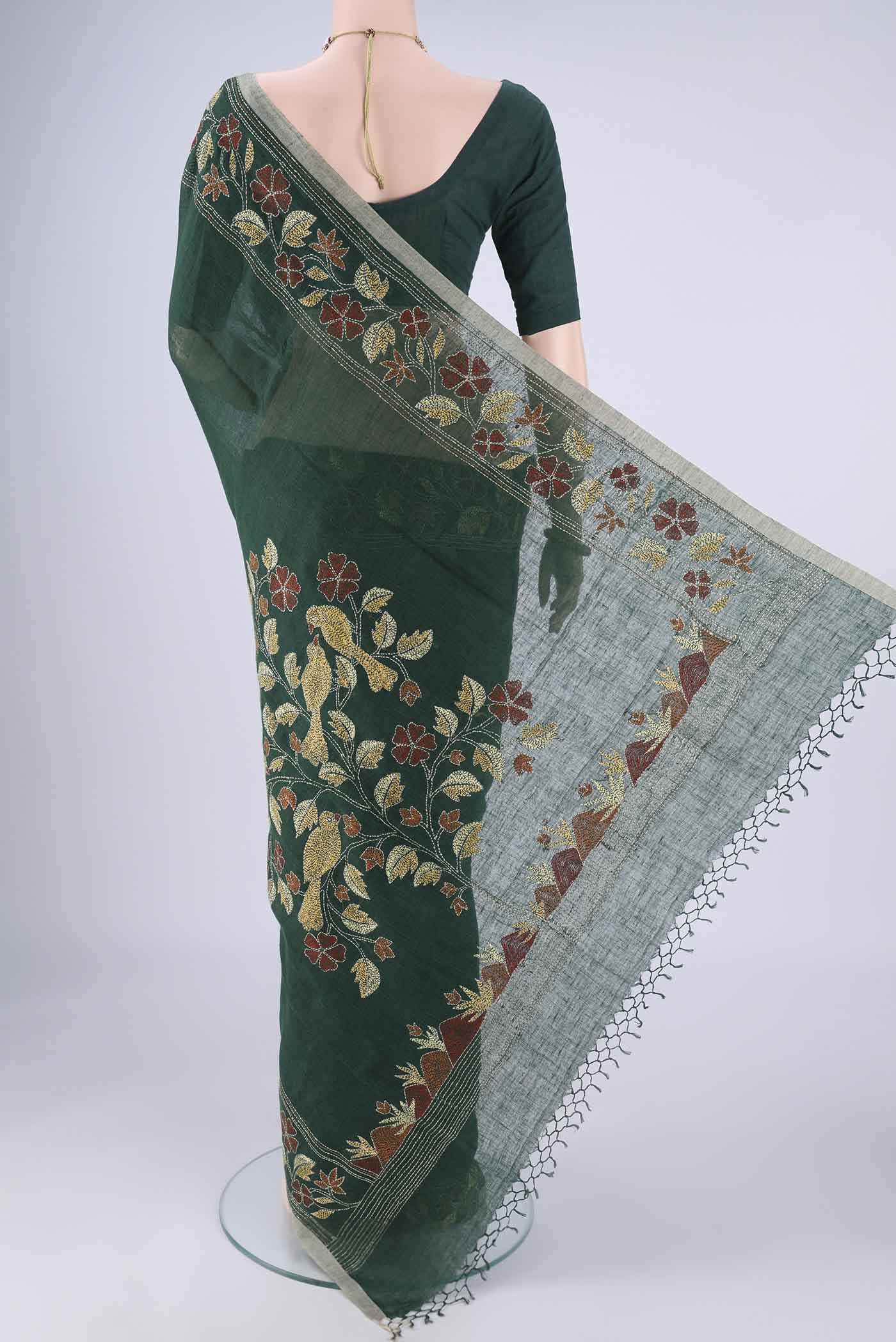 Flat view of Bottle Green Linen Cotton Saree with Kantha Work on the body and Thread Border. 