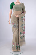 Dark Beige Linen Saree with Kantha Work on the body and Thread Border.  displayed on a mannequin