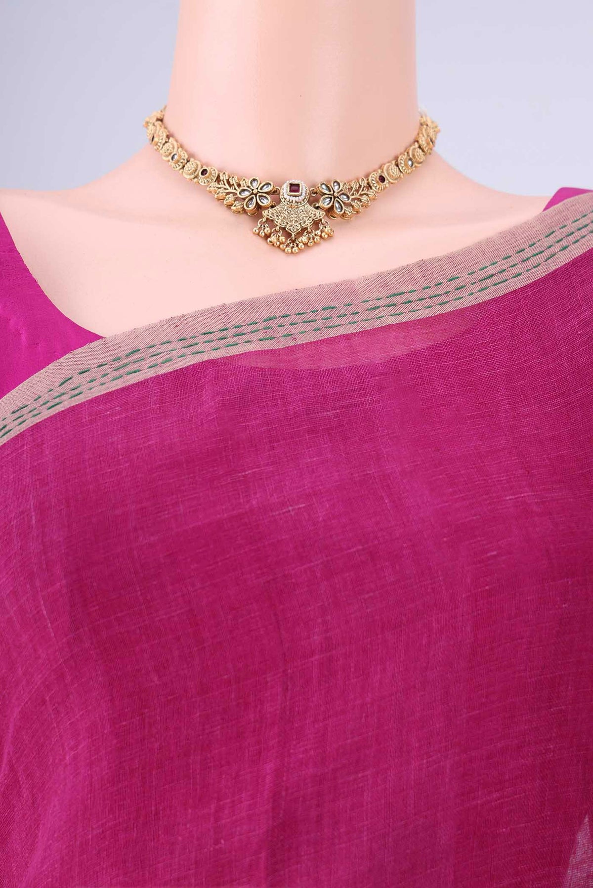 Border image of Light Magenta Linen Cotton Saree with Kantha Work on the body and Thread Border. 