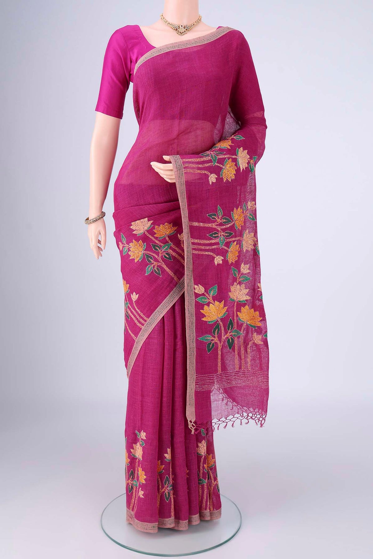 Light Magenta Linen Cotton Saree with Kantha Work on the body and Thread Border.  displayed on a mannequin
