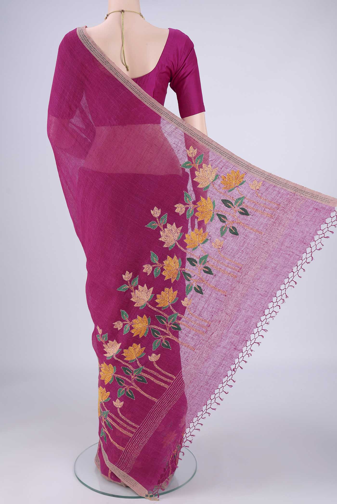 Flat view of Light Magenta Linen Cotton Saree with Kantha Work on the body and Thread Border. 