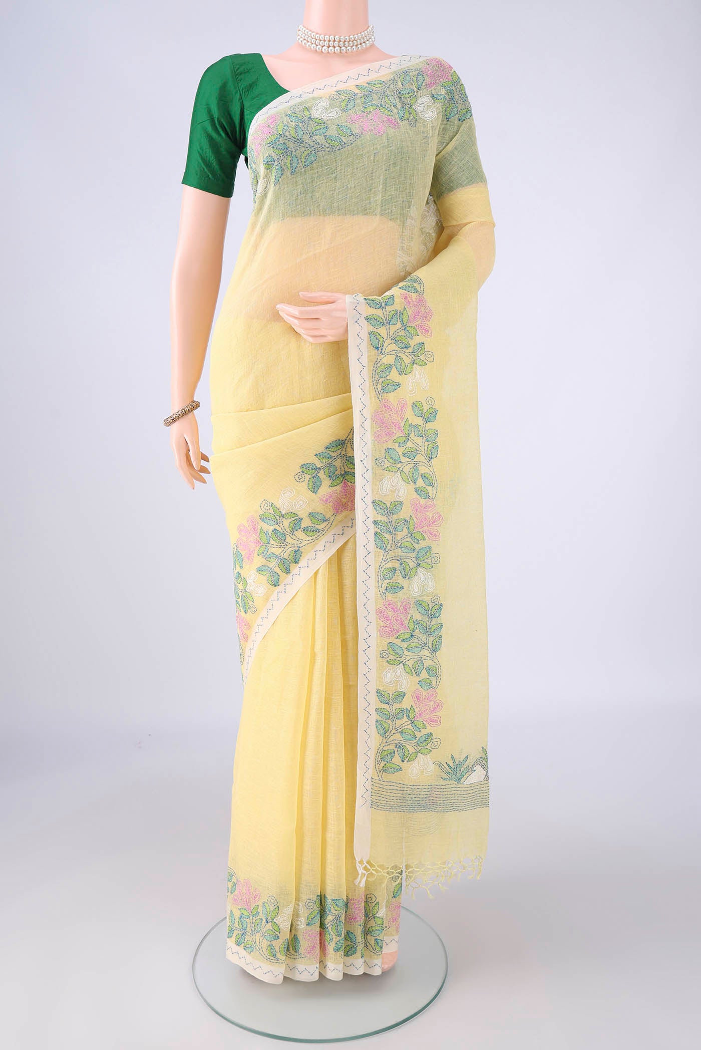 Lemon Yellow Linen Saree with Plain Body and Thread Border.  displayed on a mannequin