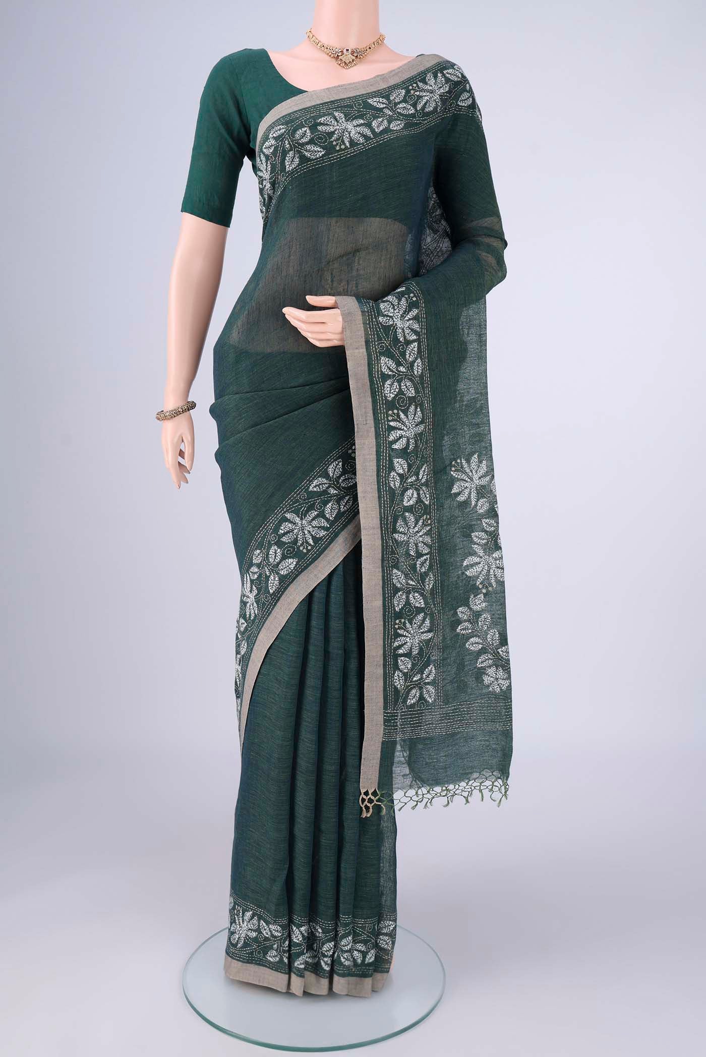 Olive Green Linen Cotton Saree with Kantha Work on the body and Thread Border.  displayed on a mannequin