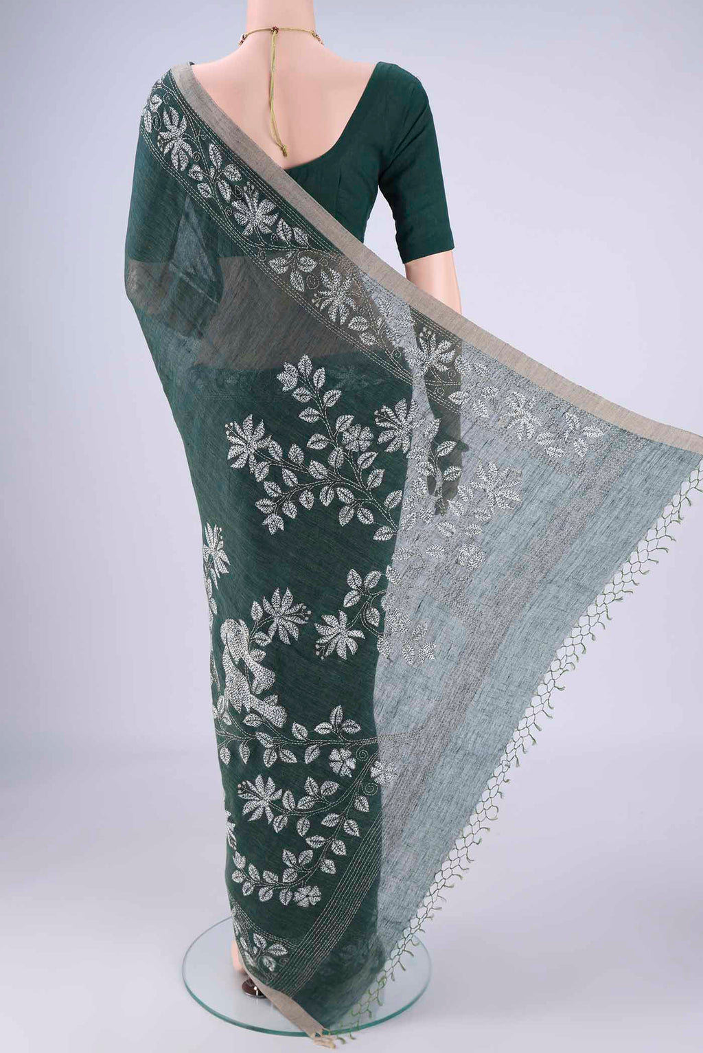 Flat view of Olive Green Linen Cotton Saree with Kantha Work on the body and Thread Border. 