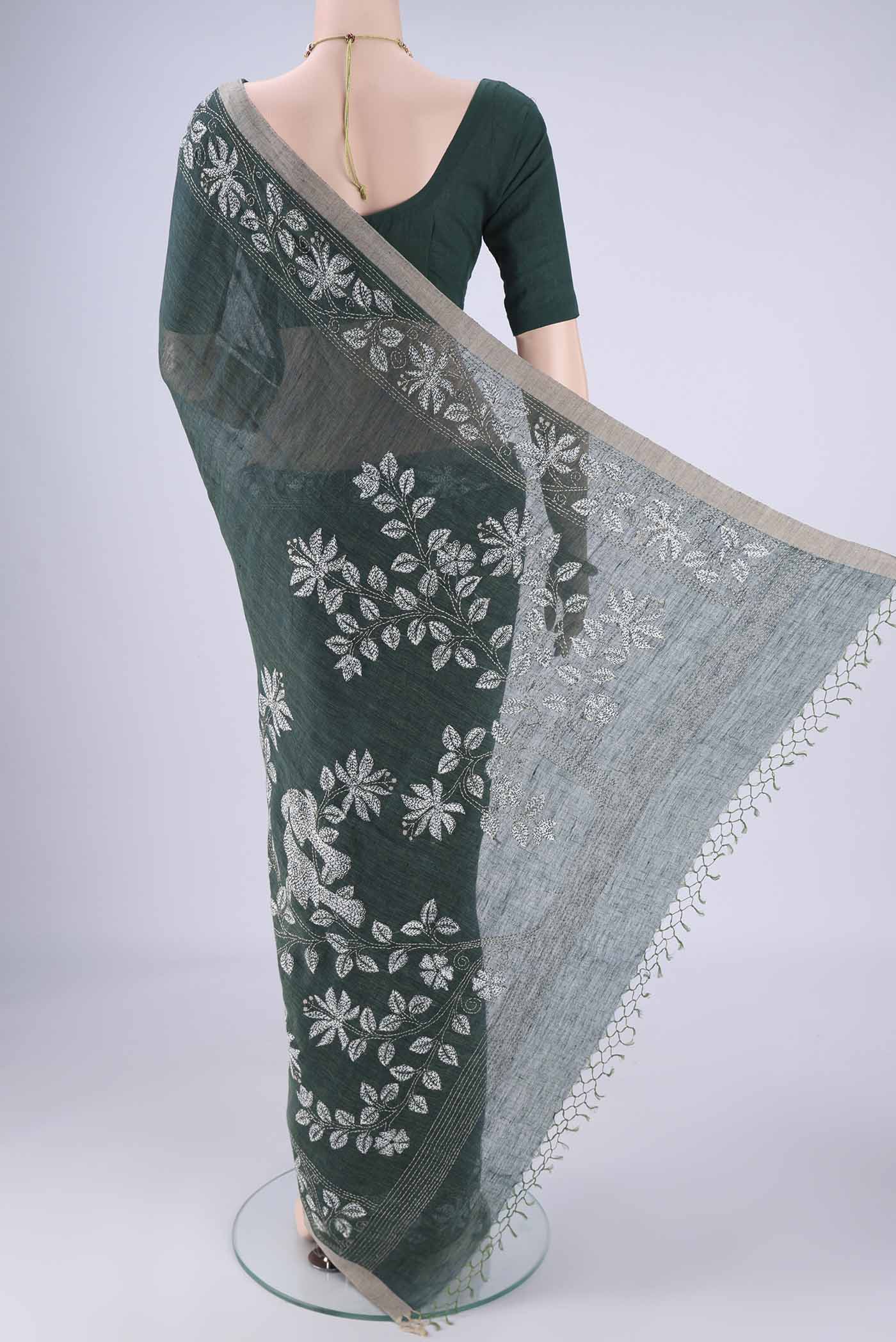Flat view of Olive Green Linen Cotton Saree with Kantha Work on the body and Thread Border. 