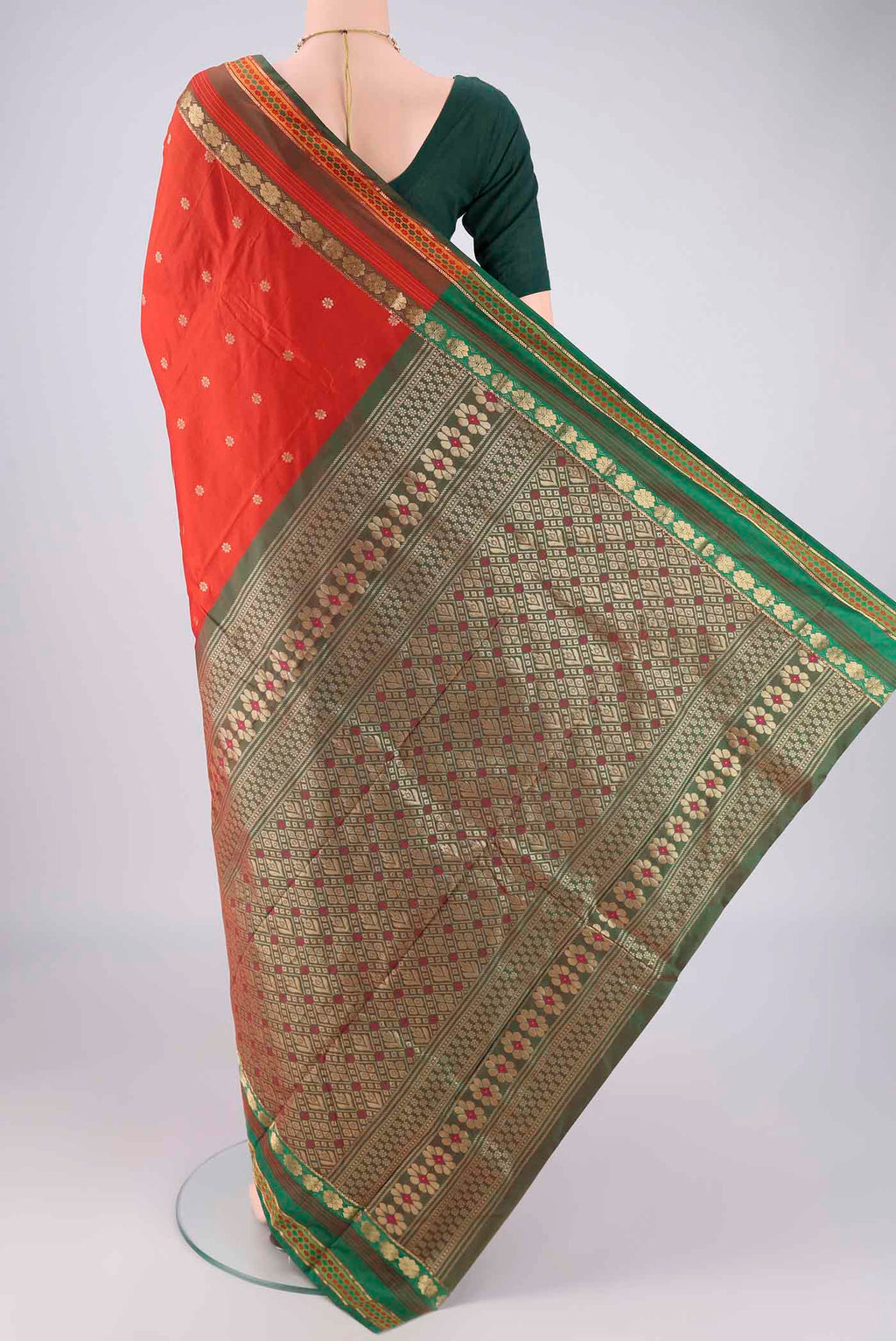 Flat view of Orange Blended Bangalore Silk Saree with Zari Butta on the body and Zari Border. 