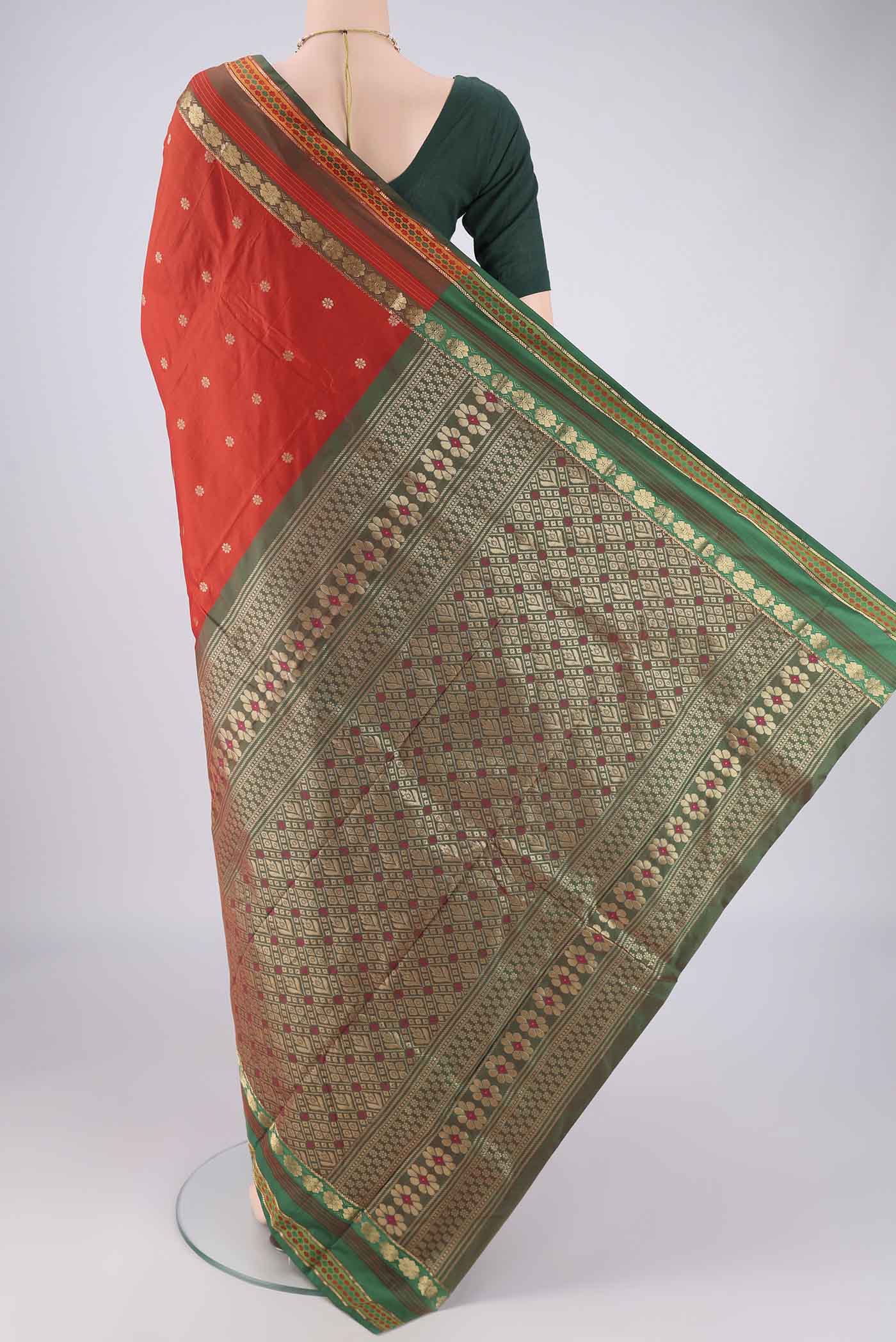 Flat view of Orange Blended Bangalore Silk Saree with Zari Butta on the body and Zari Border. 