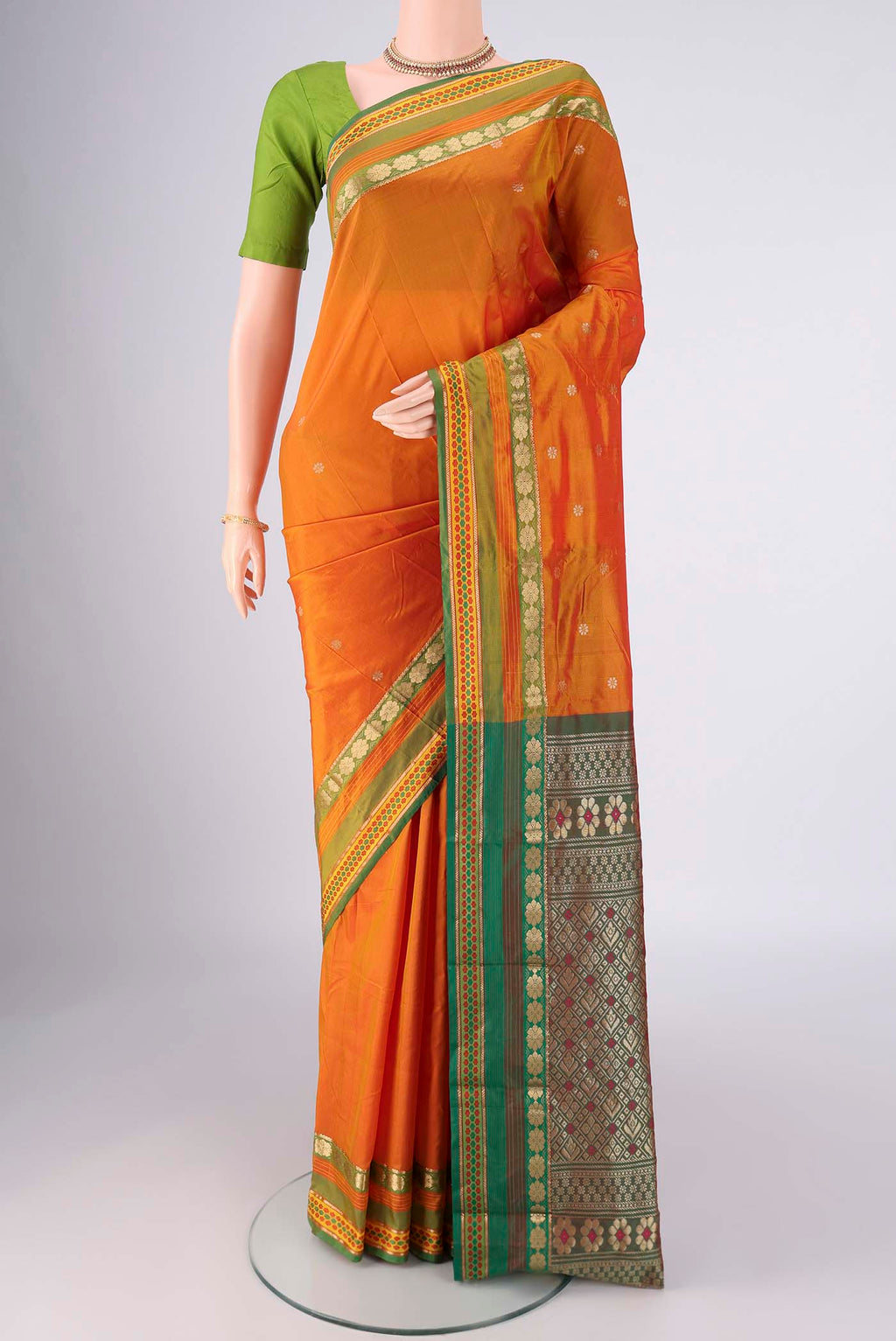 Mustard Blended Bangalore Silk Saree with Zari Butta on the body and Zari Border.  displayed on a mannequin
