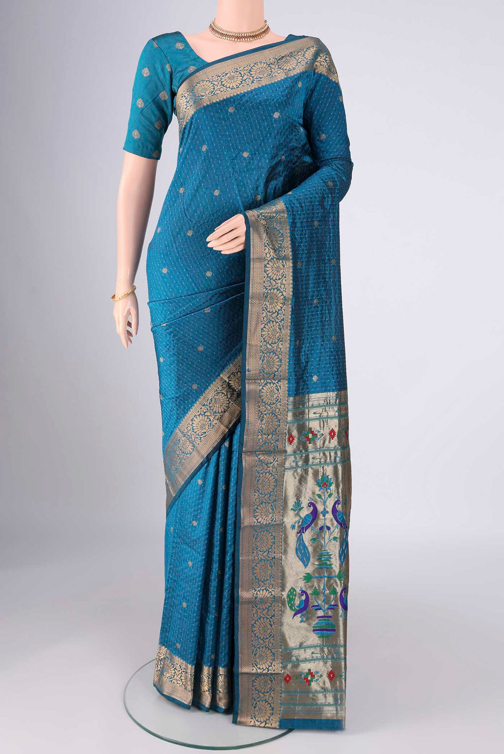 Blue Blended Bangalore Silk Saree with Jacquard With Zari Butta on the body and Zari Border.  displayed on a mannequin