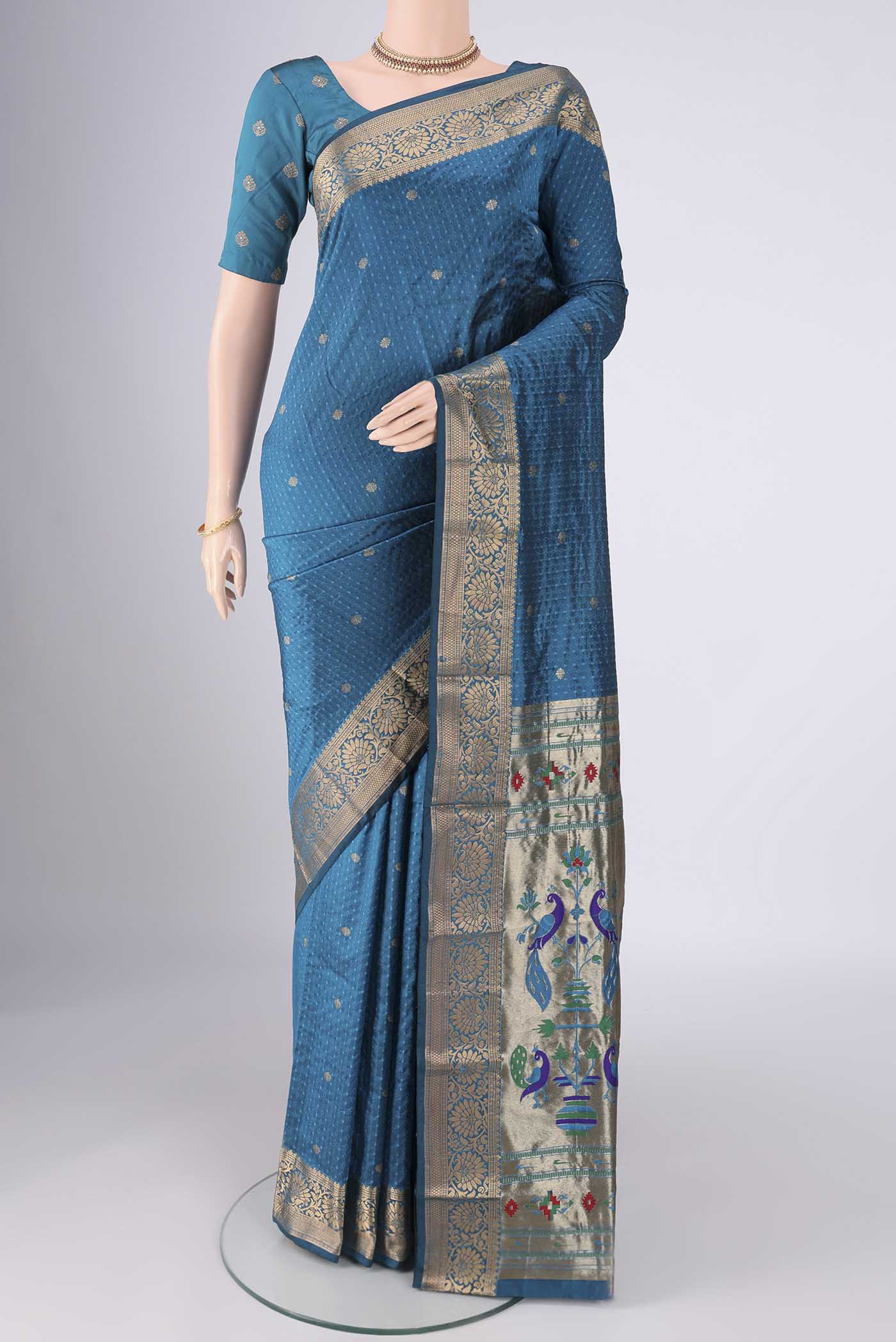 Blue Blended Bangalore Silk Saree with Jacquard With Zari Butta on the body and Zari Border.  displayed on a mannequin