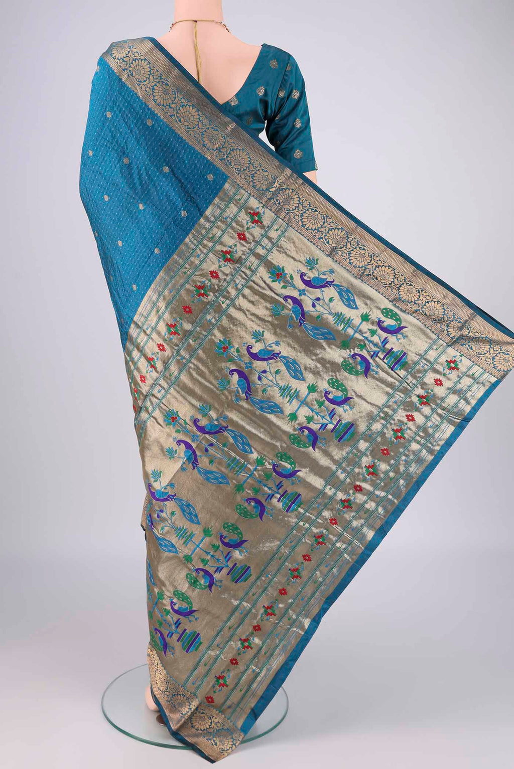 Flat view of Blue Blended Bangalore Silk Saree with Jacquard With Zari Butta on the body and Zari Border. 