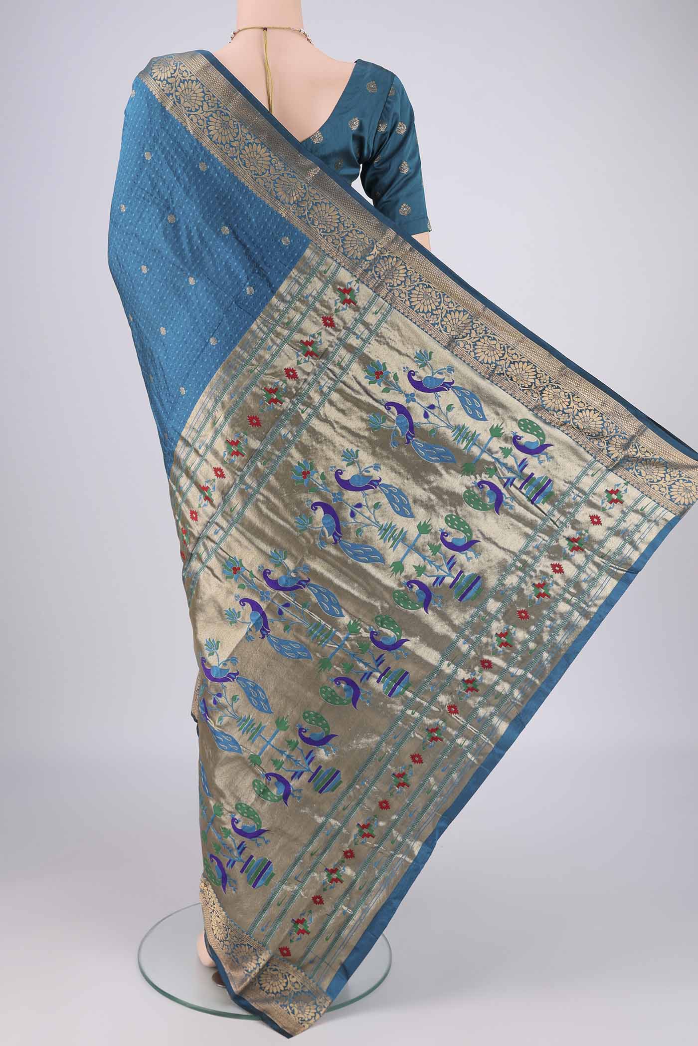 Flat view of Blue Blended Bangalore Silk Saree with Jacquard With Zari Butta on the body and Zari Border. 