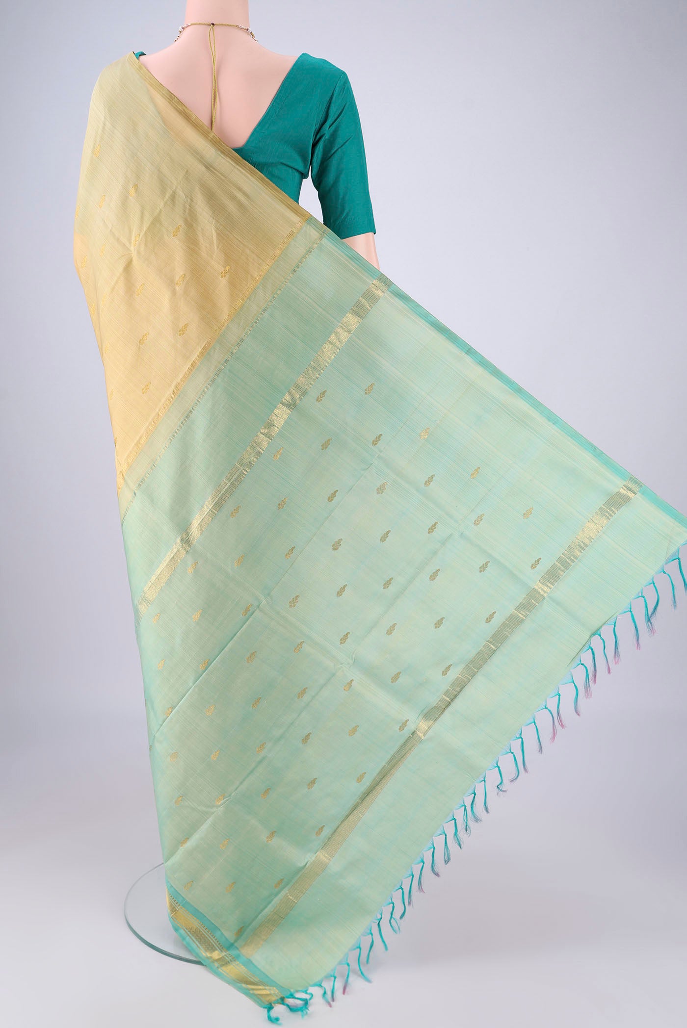 Flat view of Beige Kanjivaram Silk Saree with Zari Butta on the body and One Side Border. 