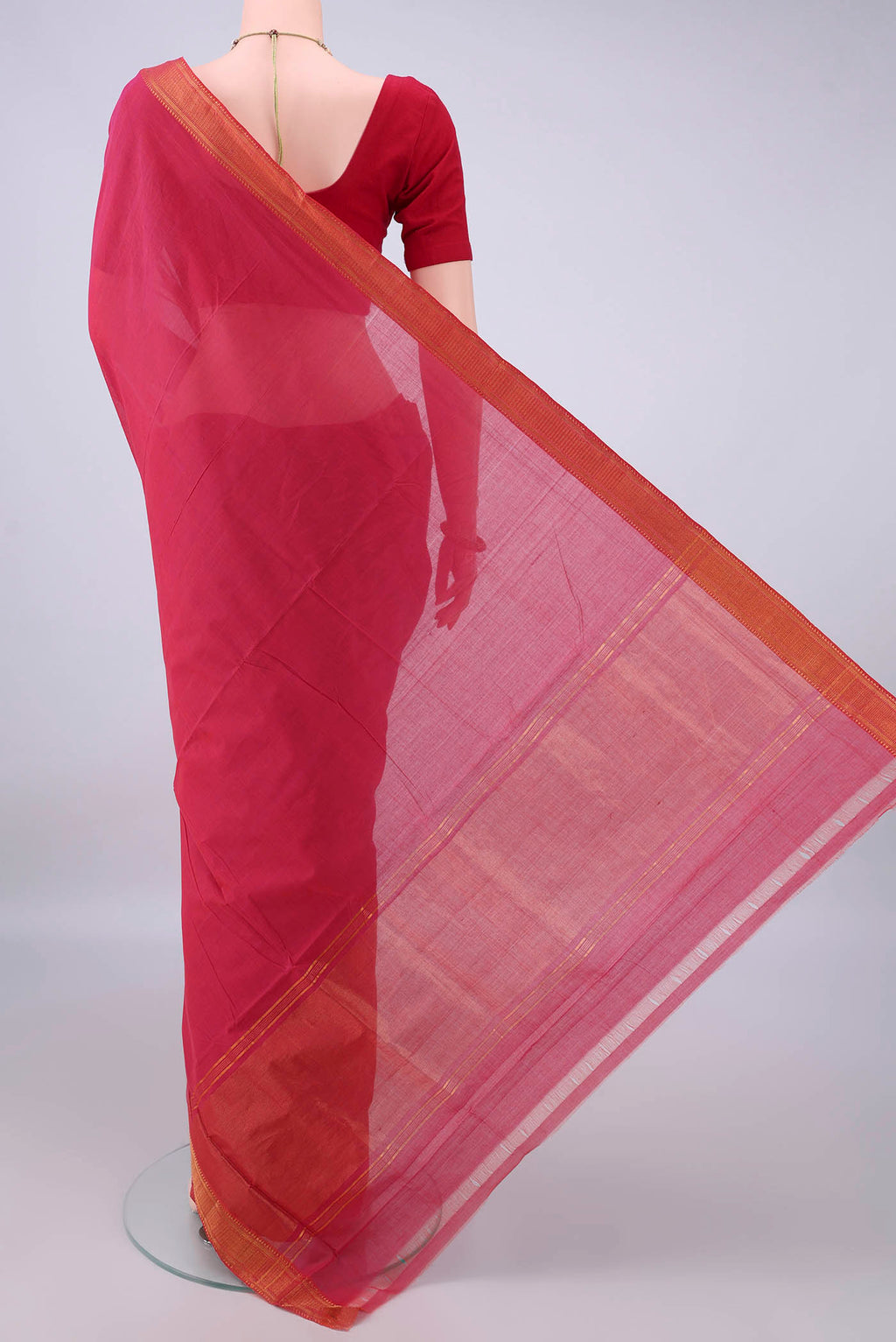 Flat view of Coral Mangalagiri Cotton Saree with Plain Body and Zari Border. 