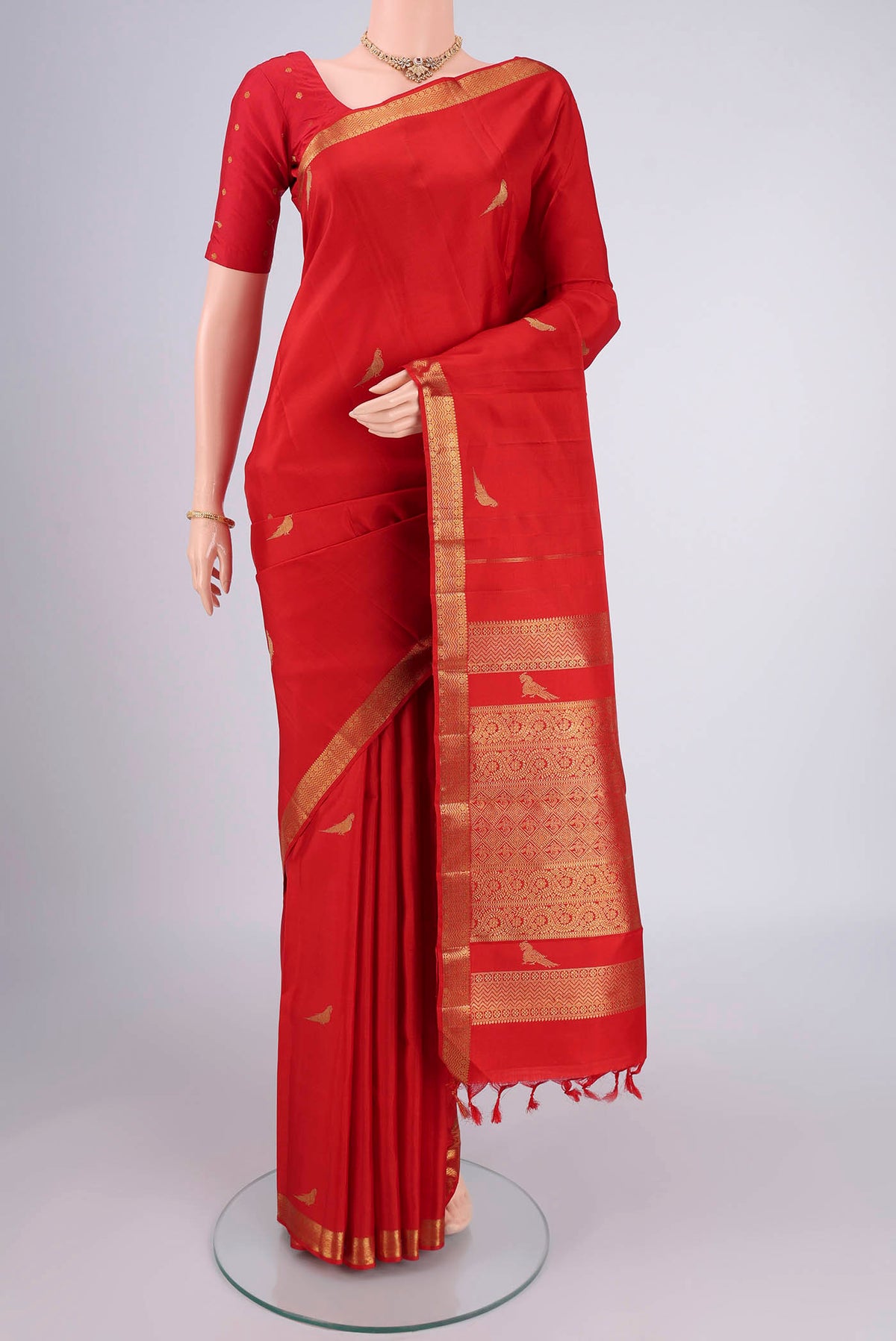 Pure Silk Pure Zari Deep Red Kanjivaram Saree with Zari Butta on the body and Zari Border.  displayed on a mannequin
