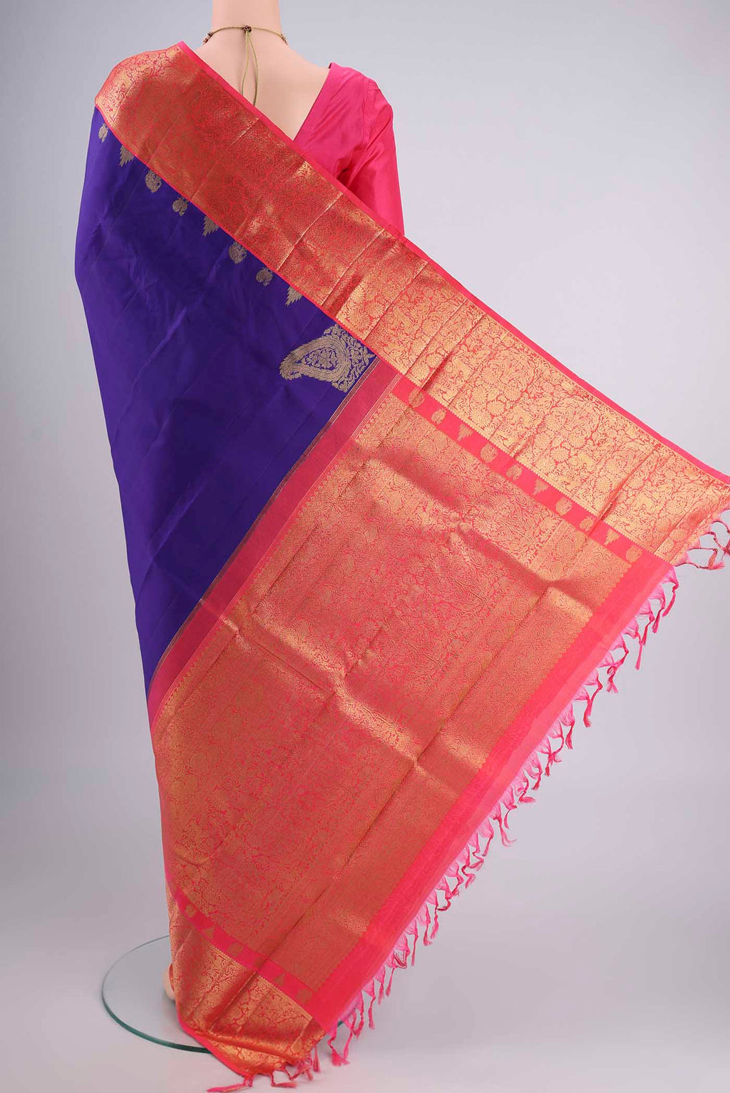 Flat view of Pure Silk Pure Zari Violet Kanjivaram Saree with Zari Butta on the body and Zari Border. 