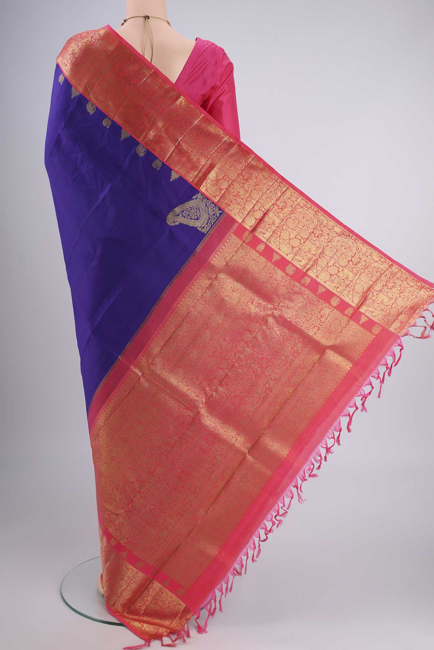 Flat view of Pure Silk Pure Zari Violet Kanjivaram Saree with Zari Butta on the body and Zari Border. 
