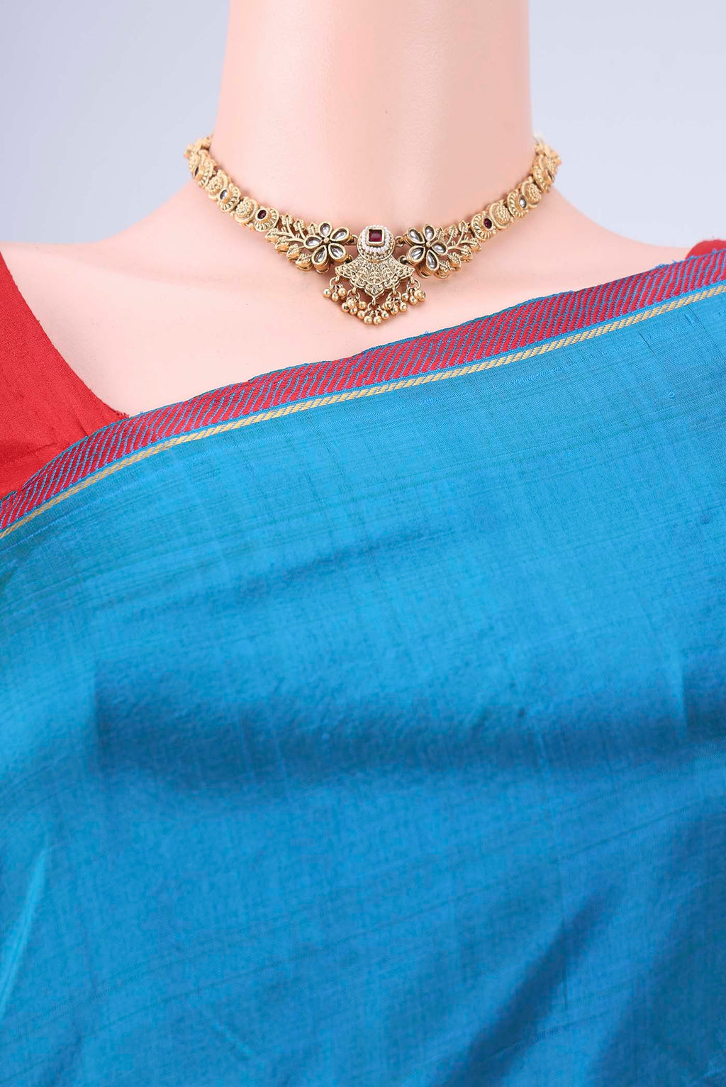 Border image of Blue Kanchipuram Silk Saree with Plain Body and Zari And Thread Border. 