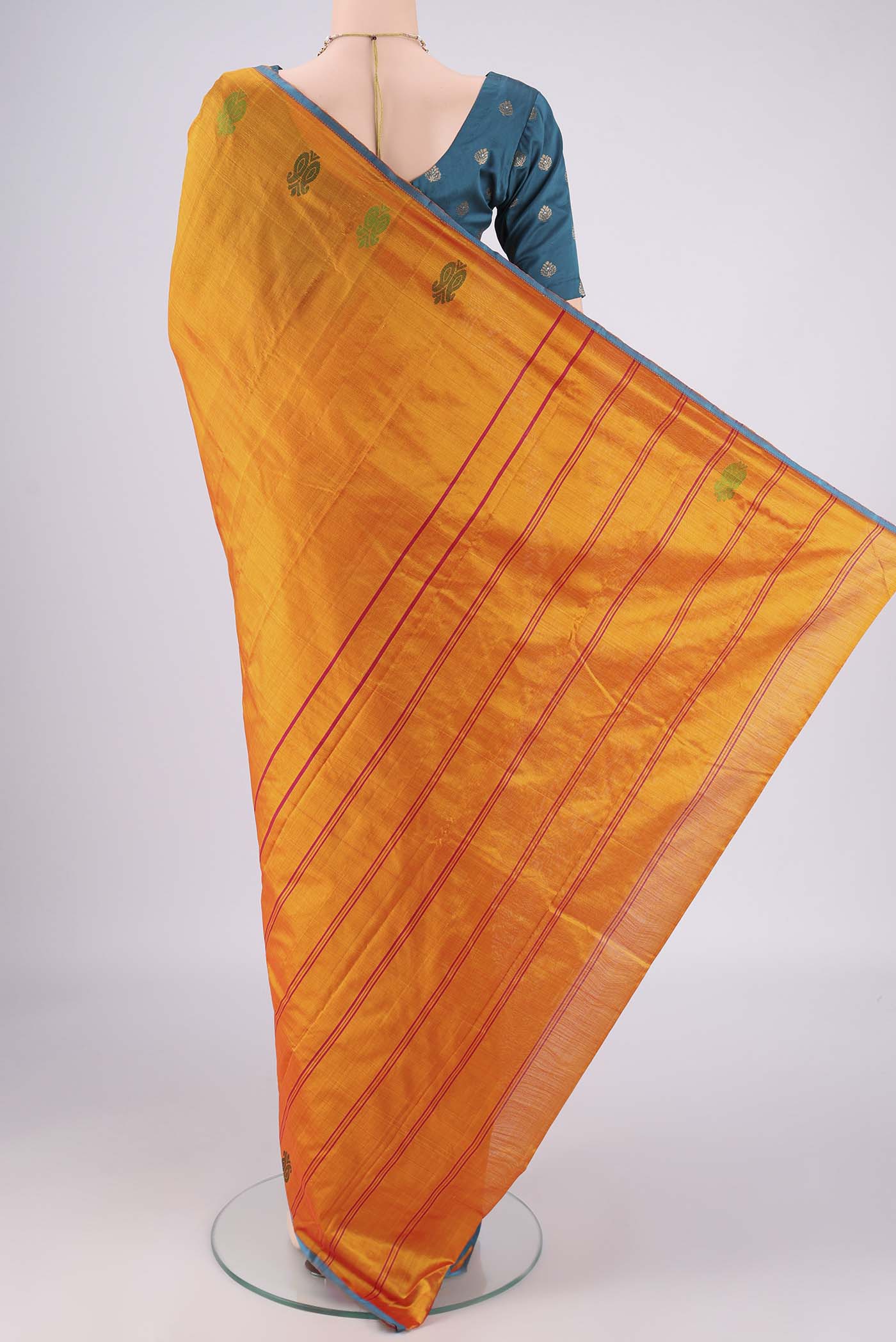 Flat view of Orange Kanchipuram Silk Saree with Plain Body and Thread Border. 