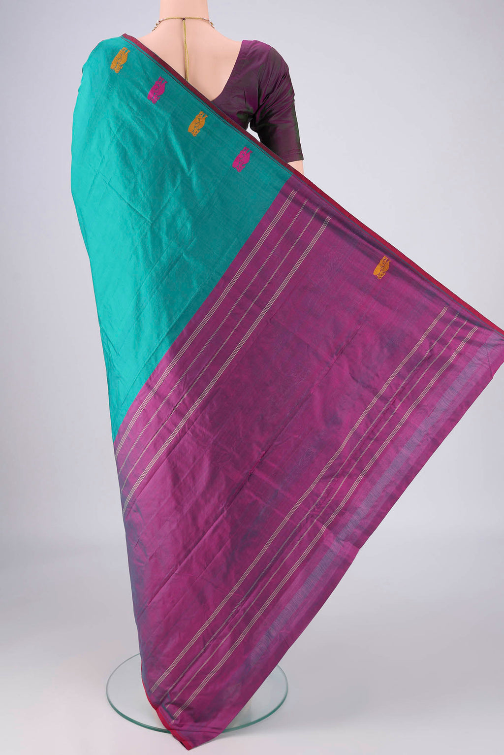 Flat view of Turquoise Kanchipuram Silk Saree with Plain Body and Thread Border. 