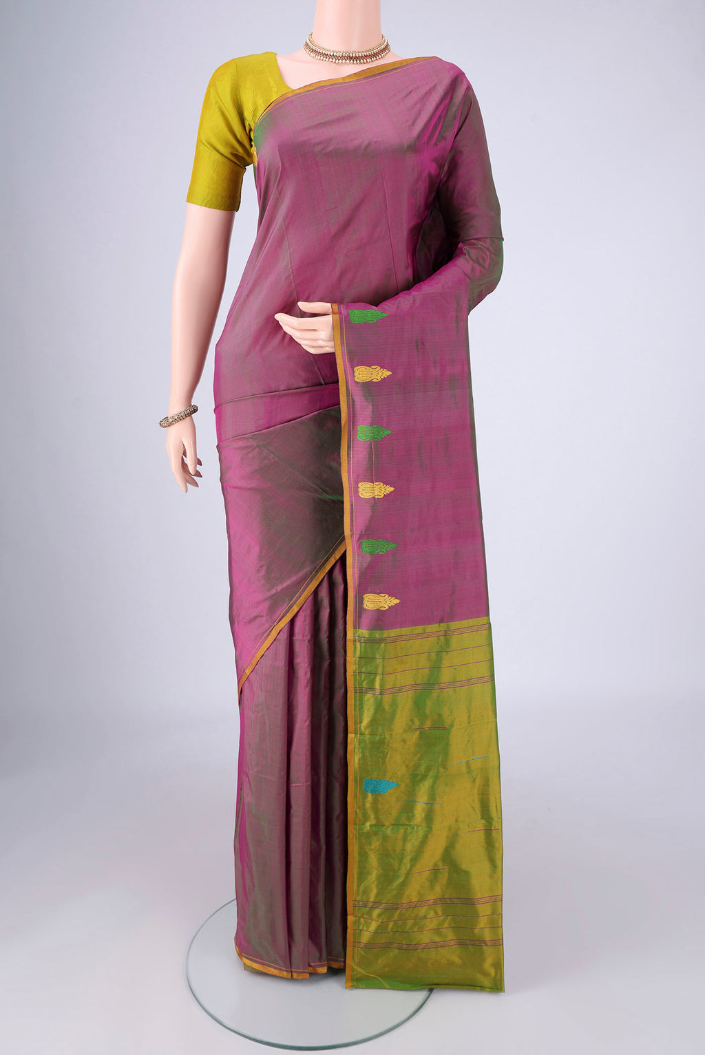 Purple Kanchipuram Silk Saree with Plain Body and Thread Border.  displayed on a mannequin