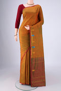 Brick Orange Kanchipuram Silk Saree with Plain Body and Thread Border.  displayed on a mannequin
