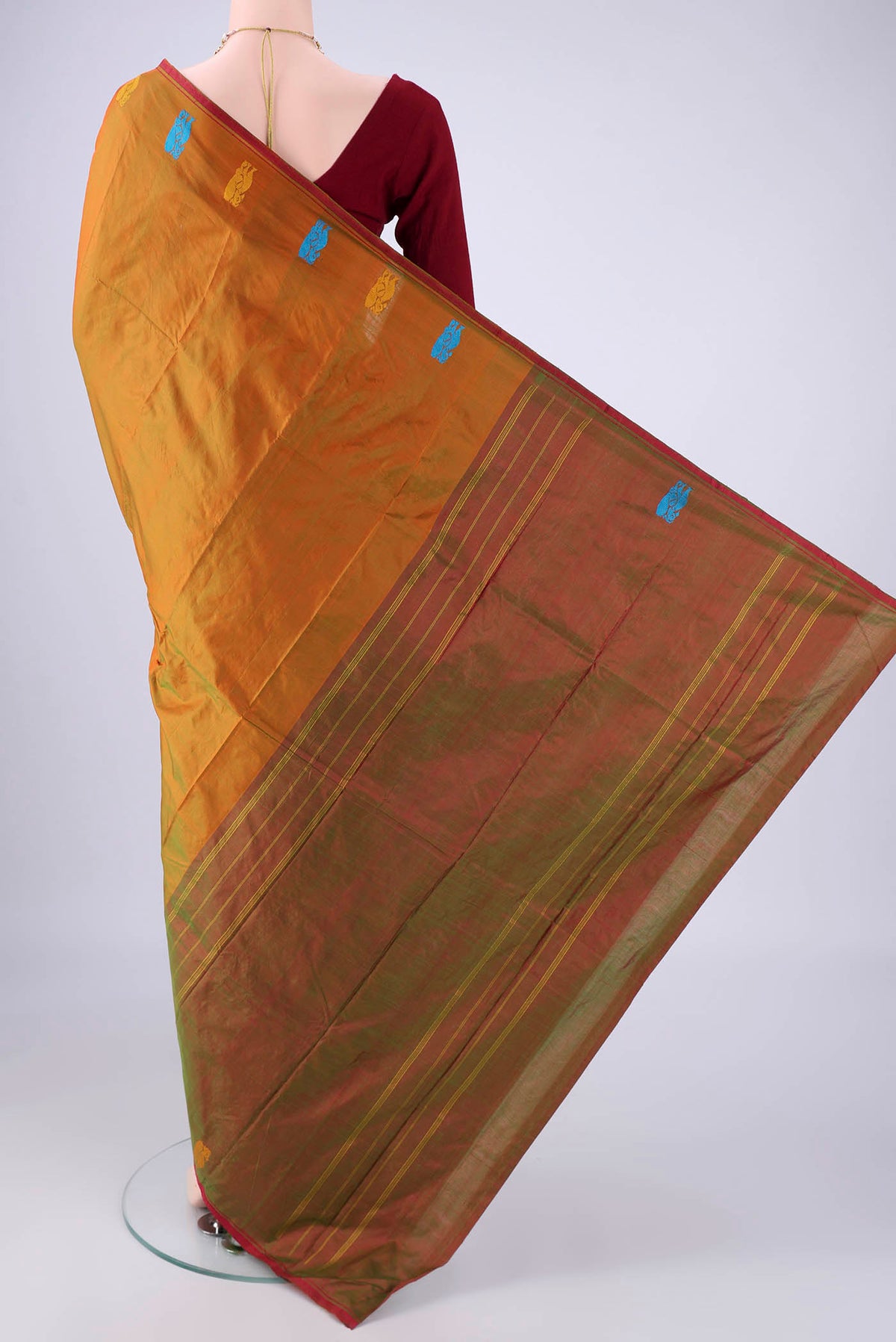Flat view of Brick Orange Kanchipuram Silk Saree with Plain Body and Thread Border. 