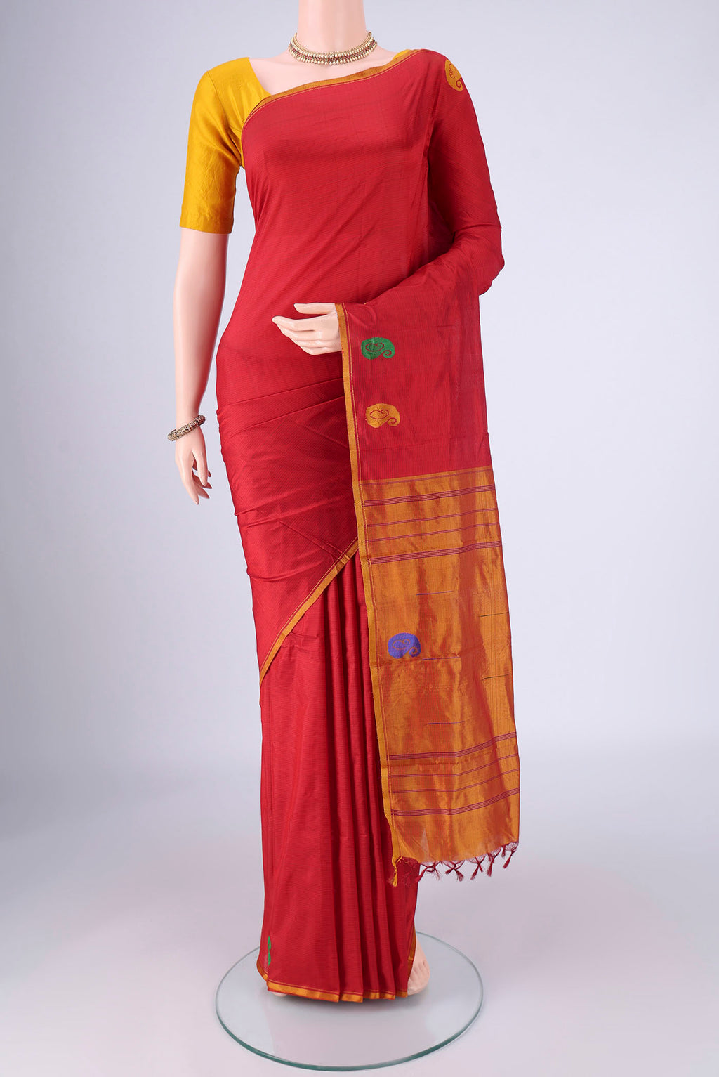 Deep Red Kanchipuram Silk Saree with Stripes on the body and Thread Border.  displayed on a mannequin