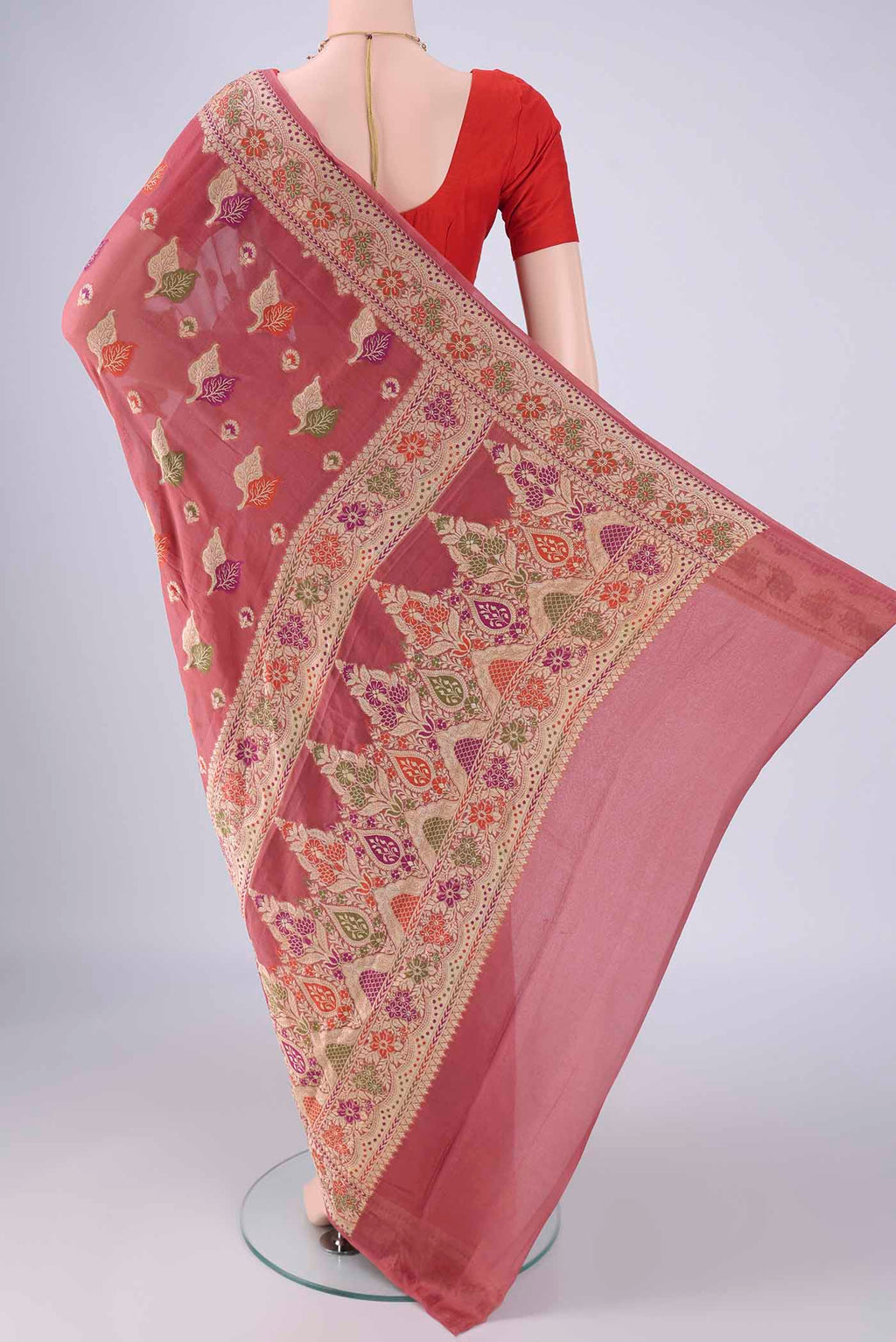 Flat view of Rose Gold Blended Banarasi Georgette Saree with Zari And Thread Butta on the body and Zari And Thread Border. 