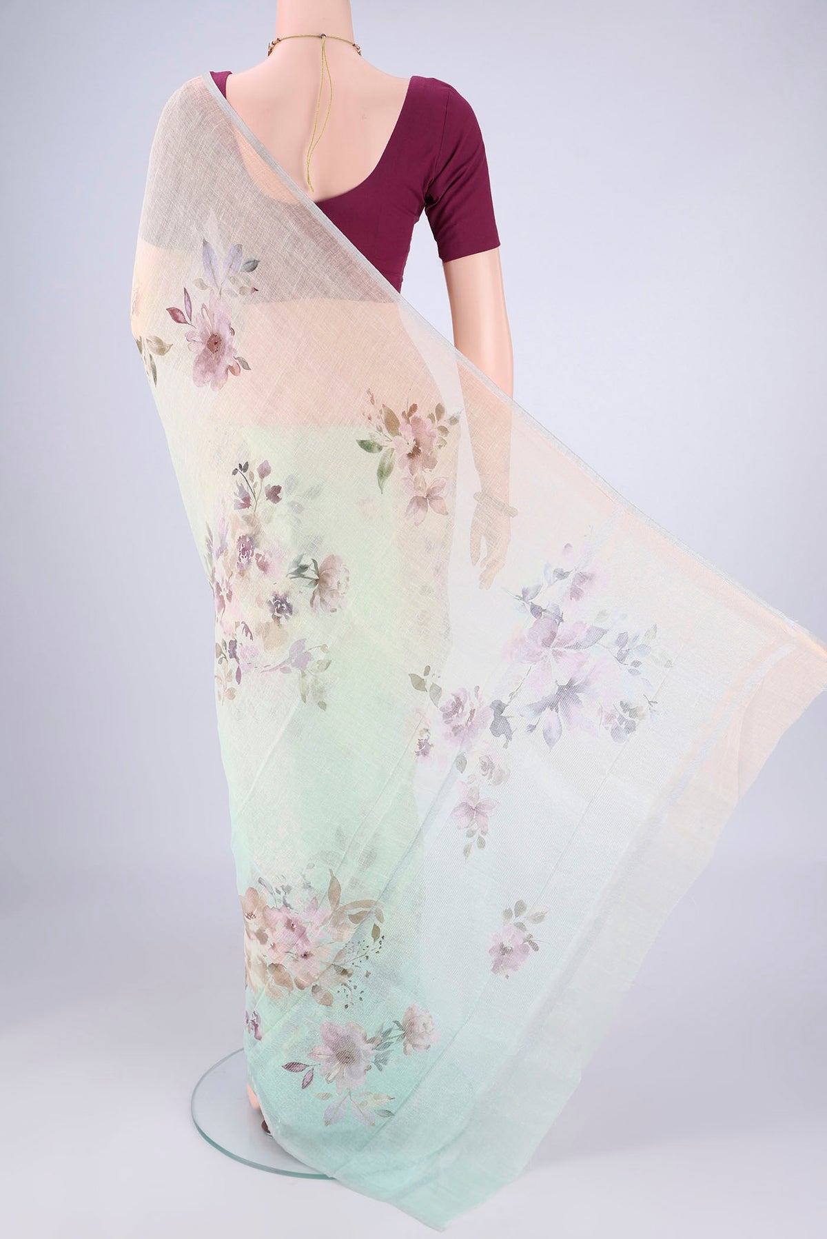 Flat view of Mint Green Linen Saree with Floral Print on the body and Zari Border. 