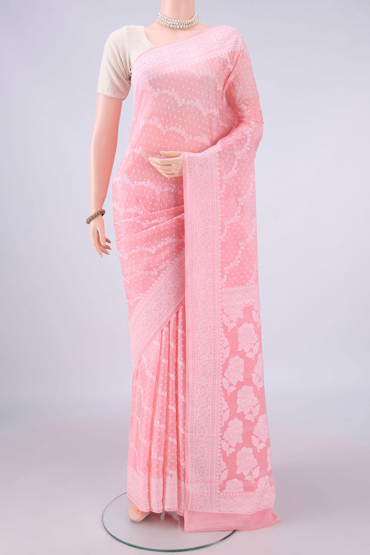 Peach Blended Banarasi Georgette Saree with Thread Brocade on the body and Thread Border.  displayed on a mannequin