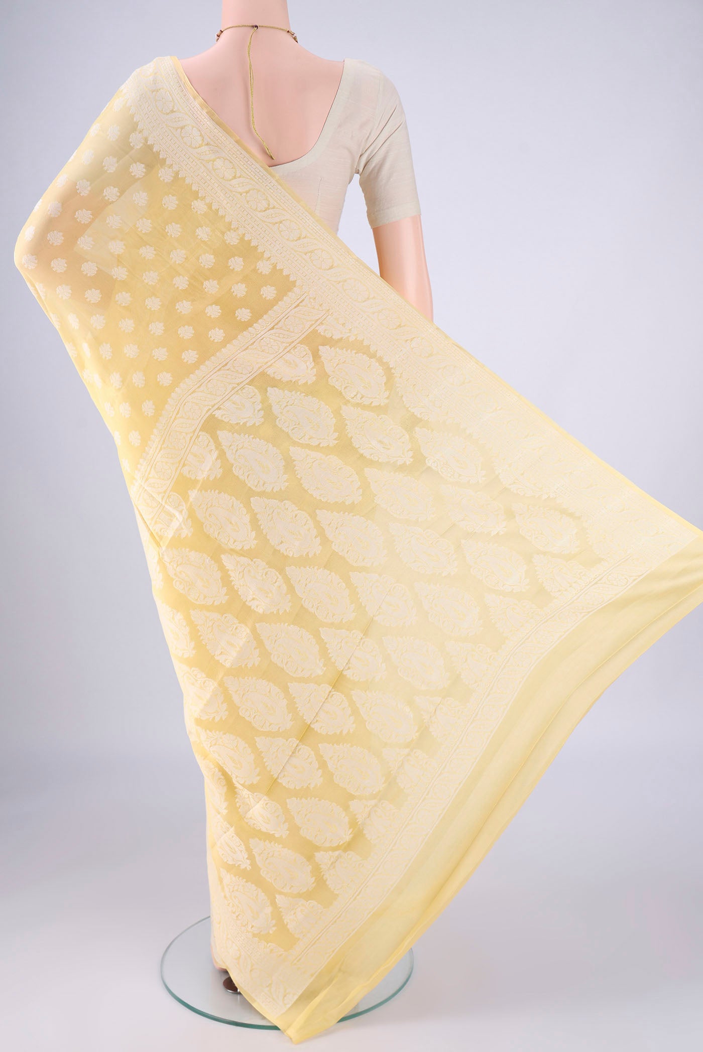 Flat view of Lemon Yellow Blended Banarasi Georgette Saree with Thread Butta on the body and Thread Border. 