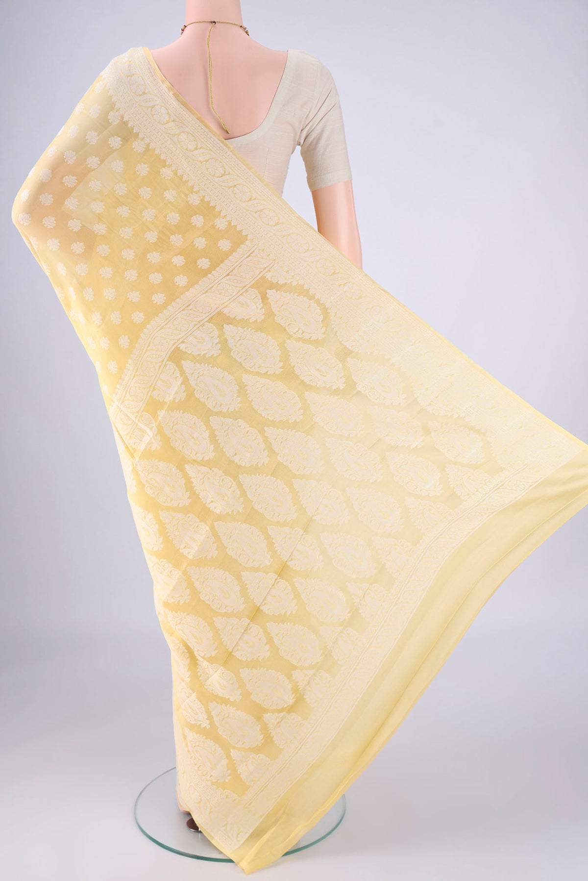 Flat view of Lemon Yellow Blended Banarasi Georgette Saree with Thread Butta on the body and Thread Border. 