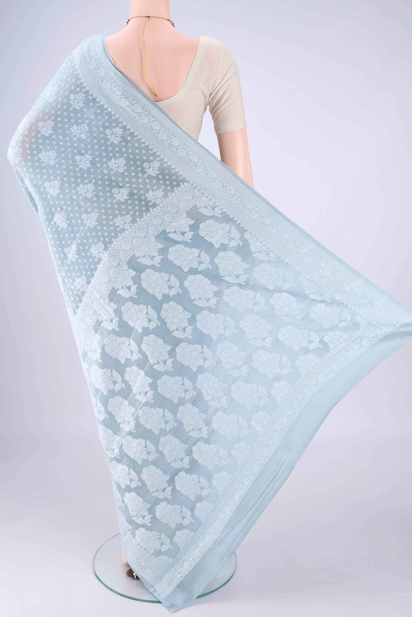 Flat view of Blue Grey Blended Banarasi Georgette Saree with Thread Butta on the body and Thread Border. 