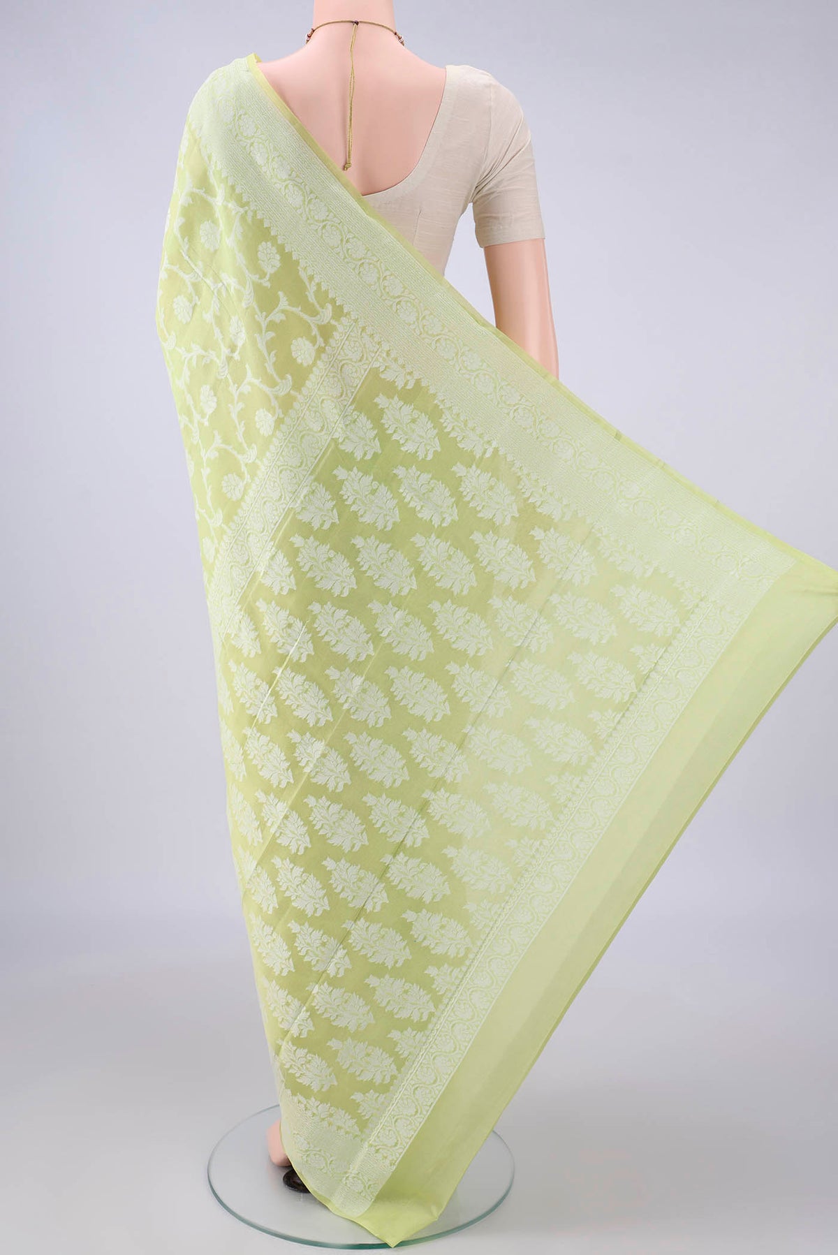 Flat view of Light Green Blended Banarasi Georgette Saree with Thread Brocade on the body and Thread Border. 