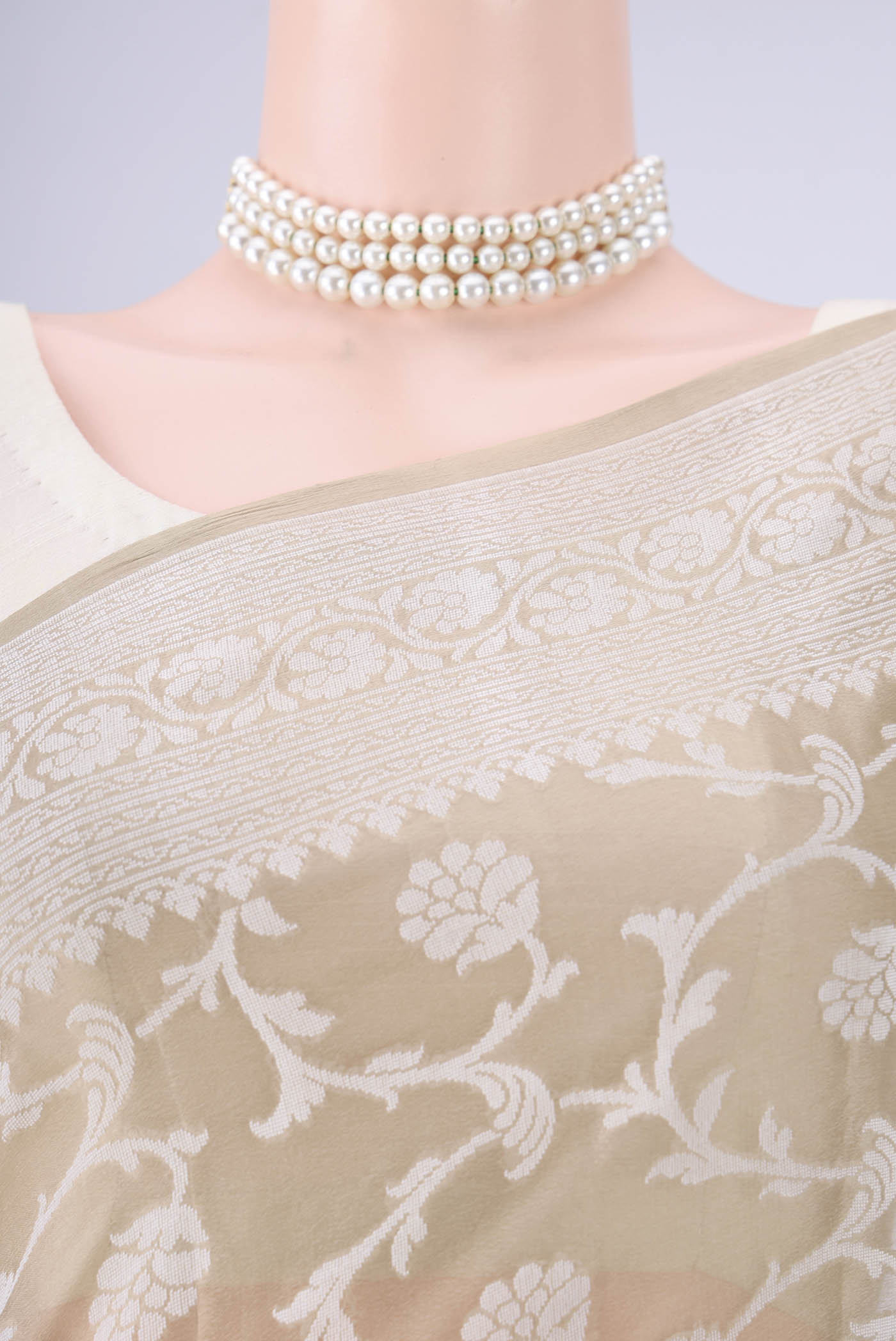 Border image of Dark Beige Blended Banarasi Georgette Saree with Thread Butta on the body and Thread Border. 