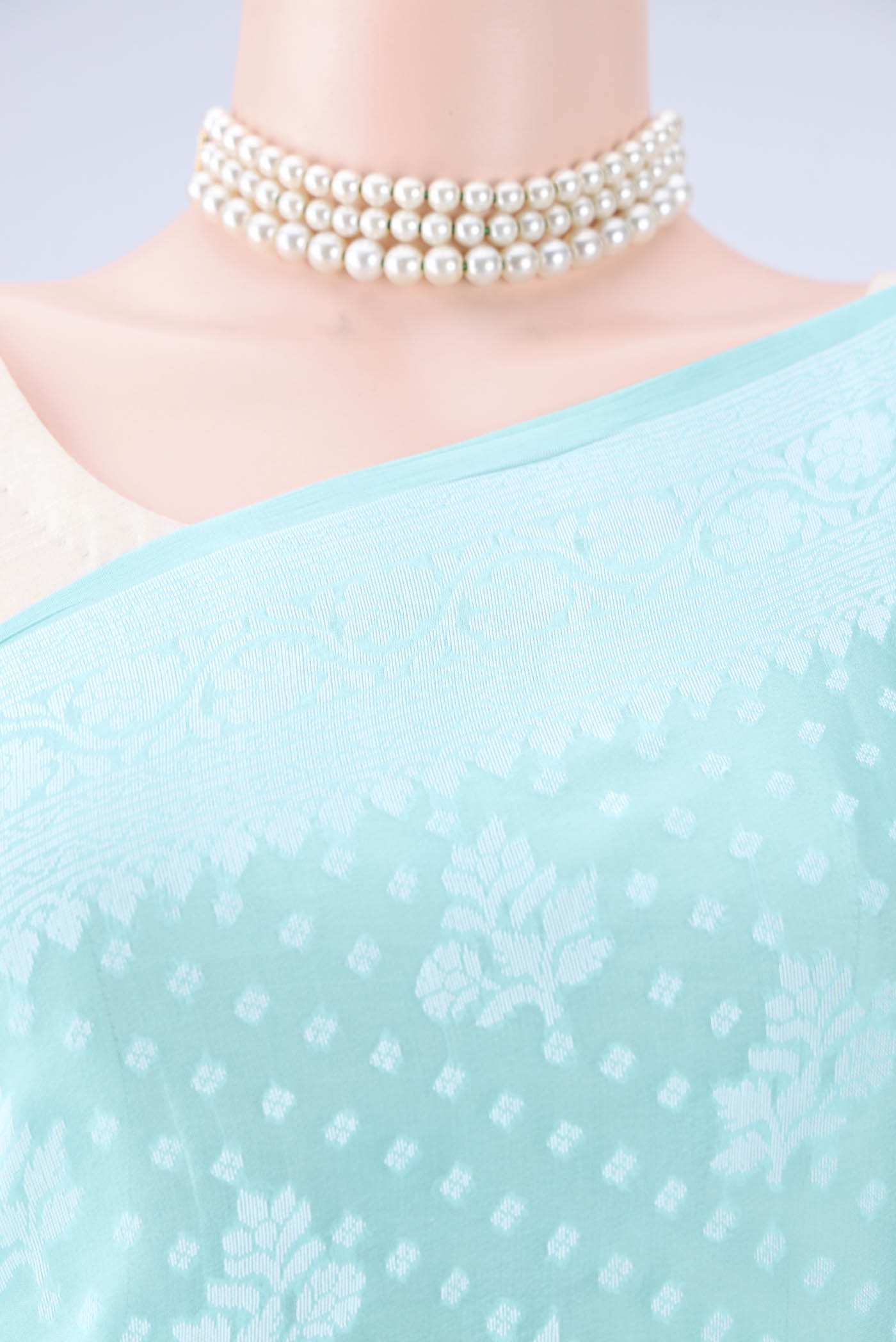 Border image of Turquoise Blended Banarasi Georgette Saree with Thread Butta on the body and Thread Border. 