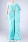 Turquoise Blended Banarasi Georgette Saree with Thread Butta on the body and Thread Border.  displayed on a mannequin