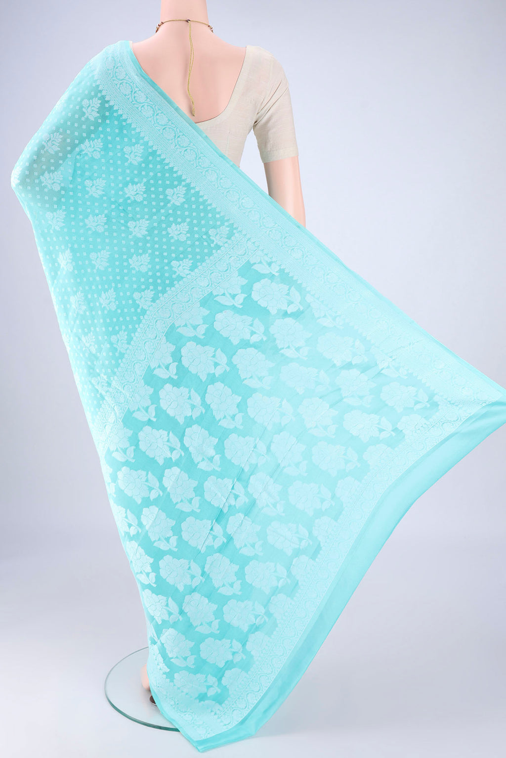 Flat view of Turquoise Blended Banarasi Georgette Saree with Thread Butta on the body and Thread Border. 
