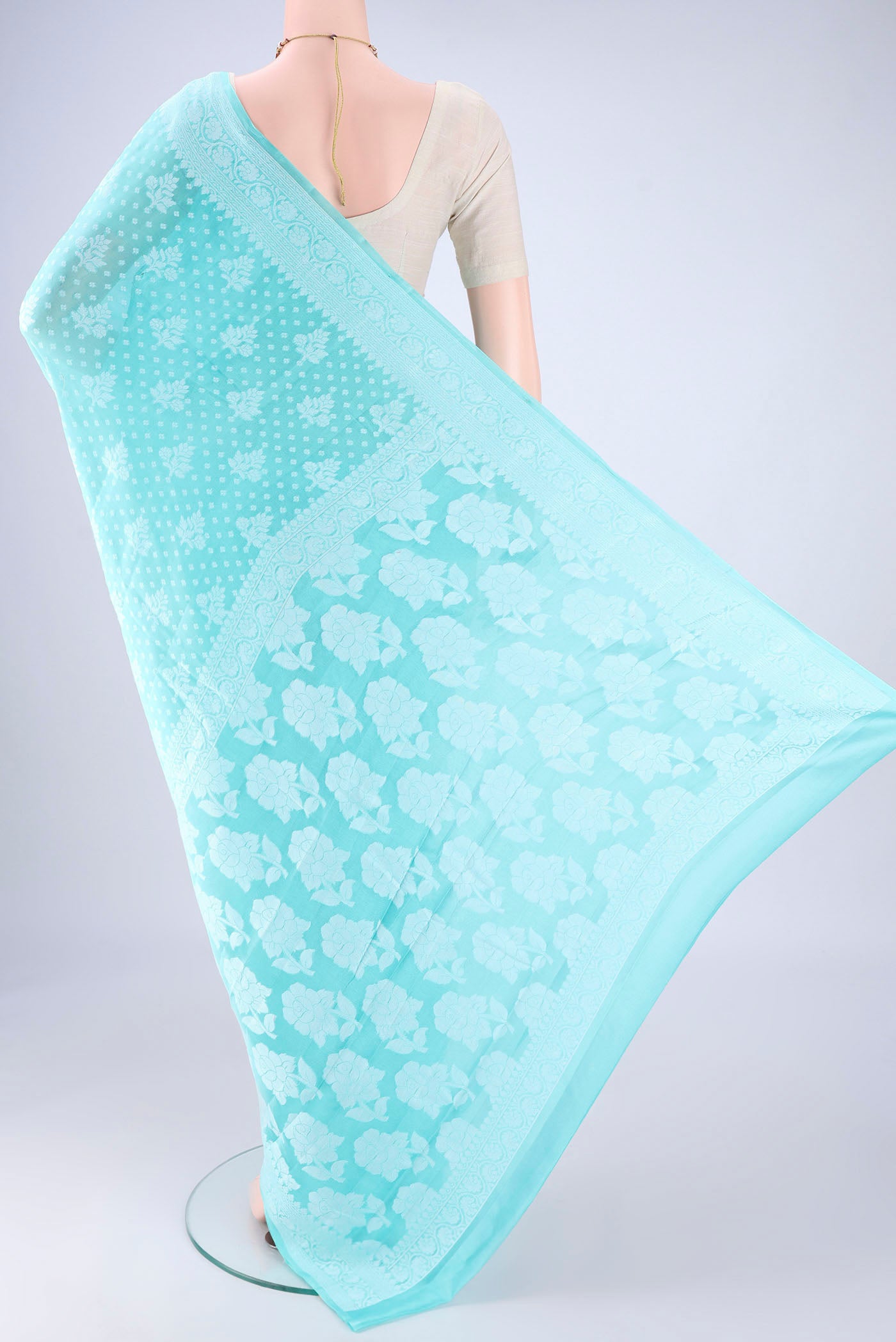 Flat view of Turquoise Blended Banarasi Georgette Saree with Thread Butta on the body and Thread Border. 