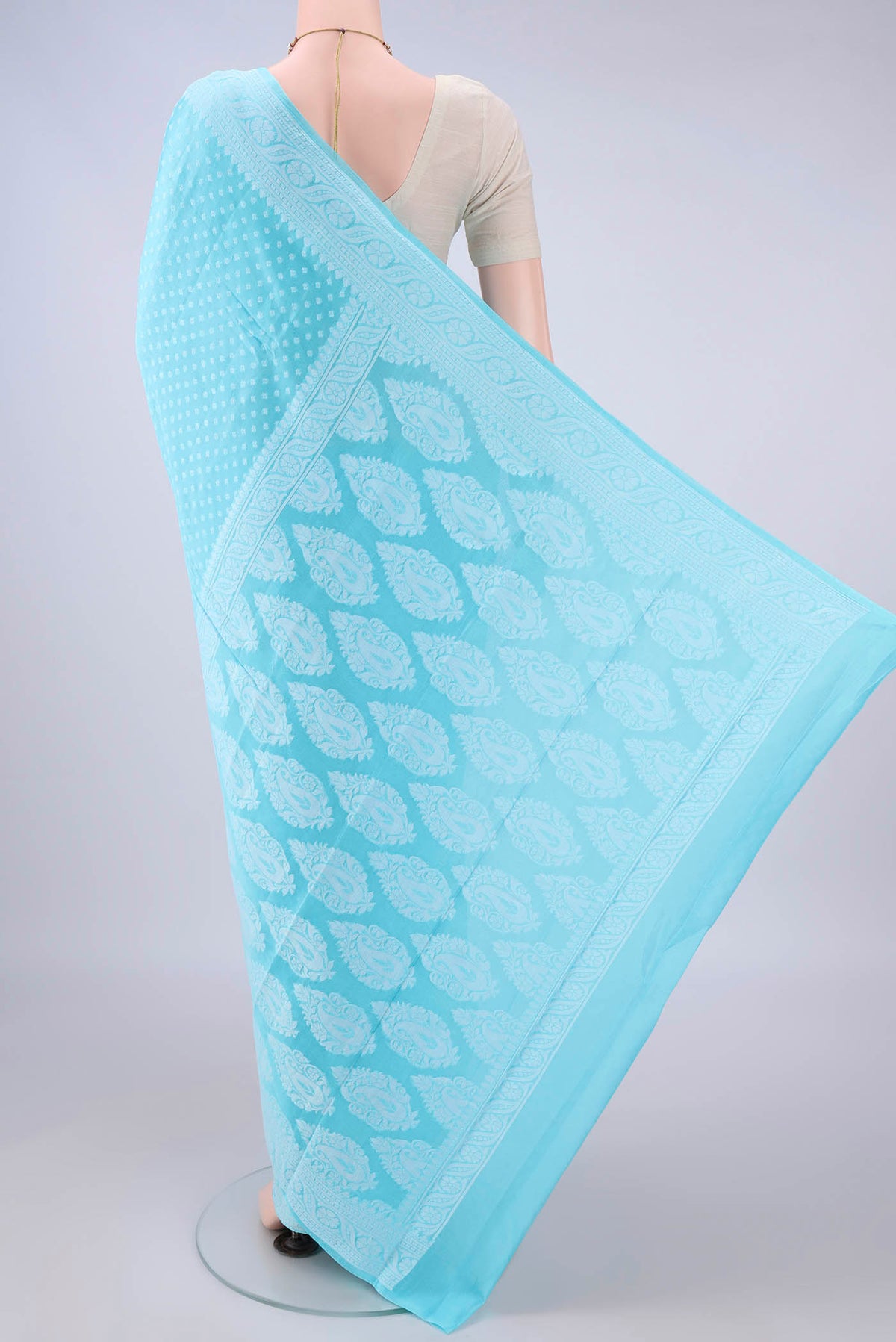 Flat view of Sky Blue Blended Banarasi Georgette Saree with Thread Butta on the body and Thread Border. 