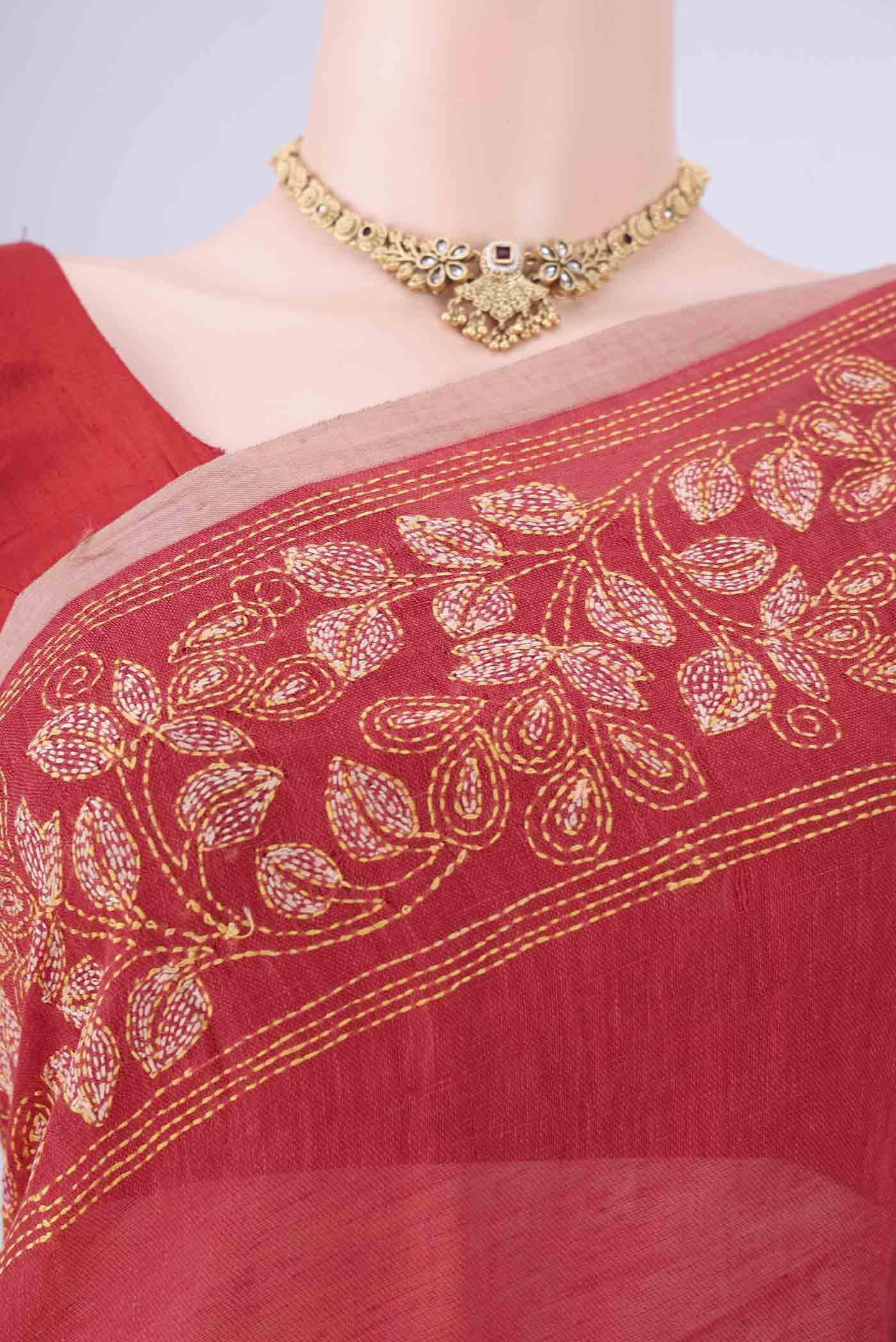 Border image of Rust Linen Cotton Saree with Kantha Work on the body and Thread Border. 