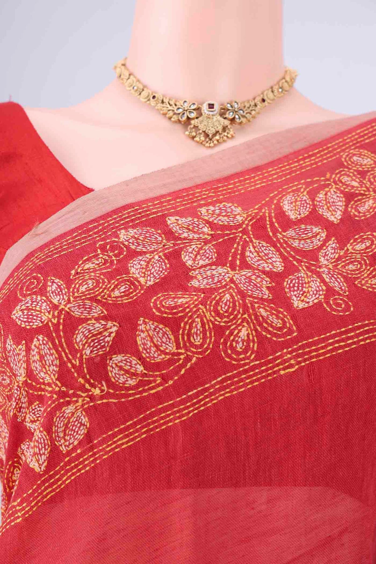 Border image of Rust Linen Cotton Saree with Kantha Work on the body and Thread Border. 