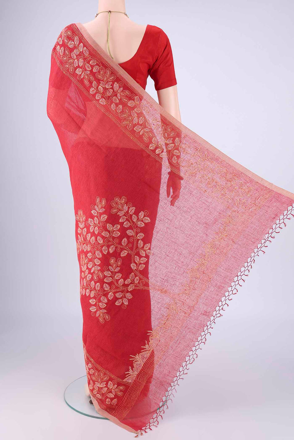Flat view of Rust Linen Cotton Saree with Kantha Work on the body and Thread Border. 