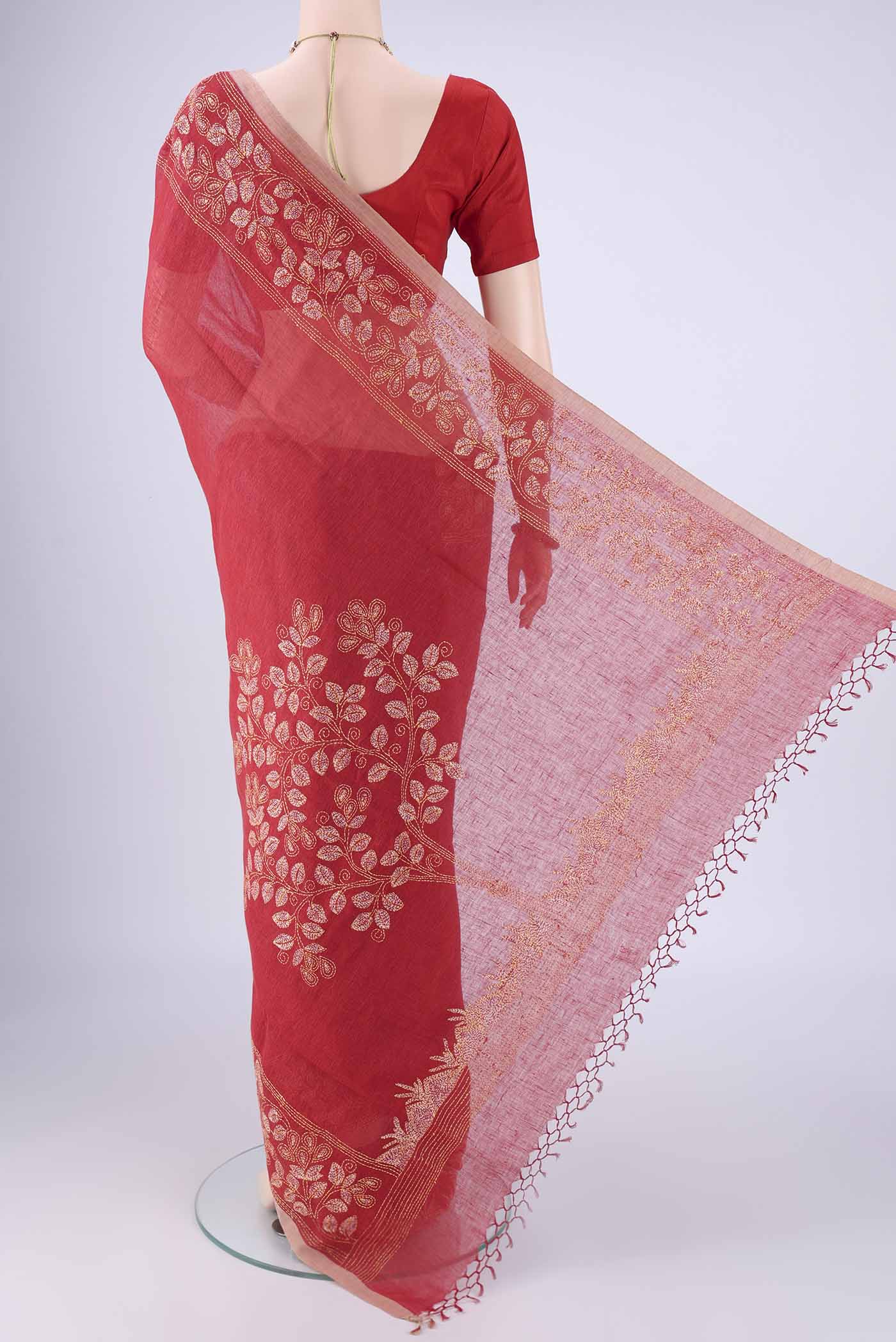 Flat view of Rust Linen Cotton Saree with Kantha Work on the body and Thread Border. 