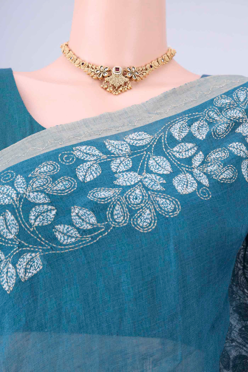 Border image of Blue Linen Cotton Saree with Kantha Work on the body and Thread Border. 
