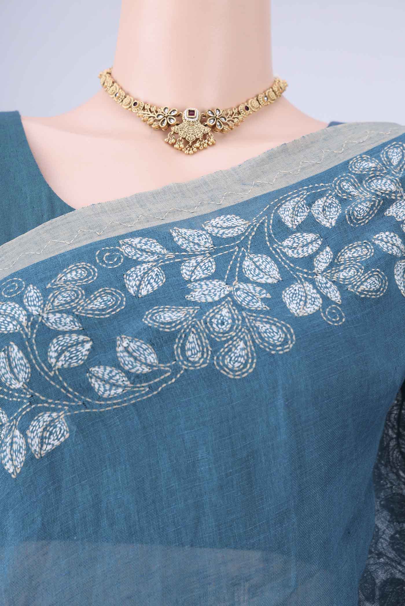 Border image of Blue Linen Cotton Saree with Kantha Work on the body and Thread Border. 