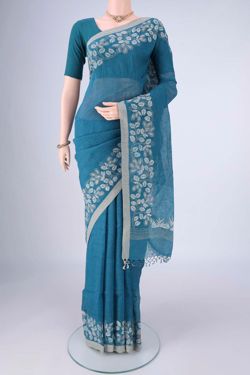 Blue Linen Cotton Saree with Kantha Work on the body and Thread Border.  displayed on a mannequin